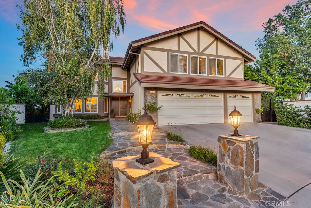 a front view of a house with garden