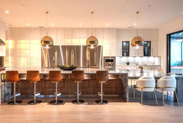 a stove top oven sitting inside of a kitchen