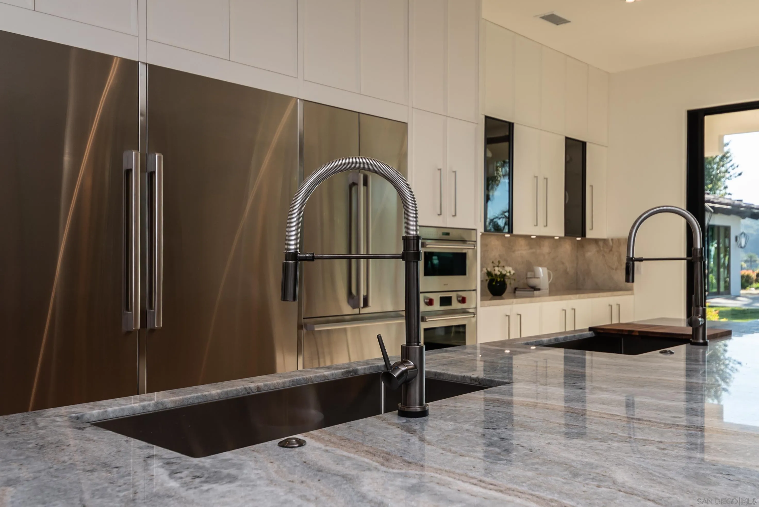 18650 Old Coach Way Poway, CA 92064 - Photo 13 of 63 a kitchen with stainless steel appliances granite countertop a refrigerator sink and cabinets