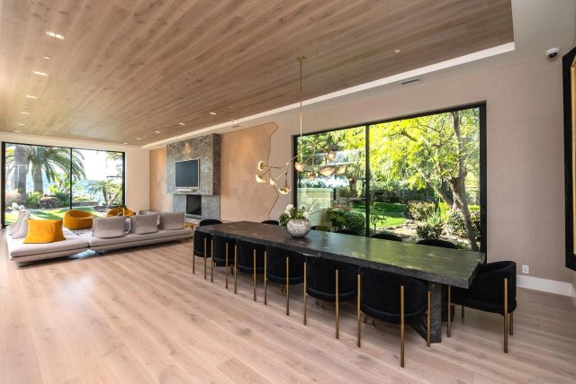 a dining room with furniture and window