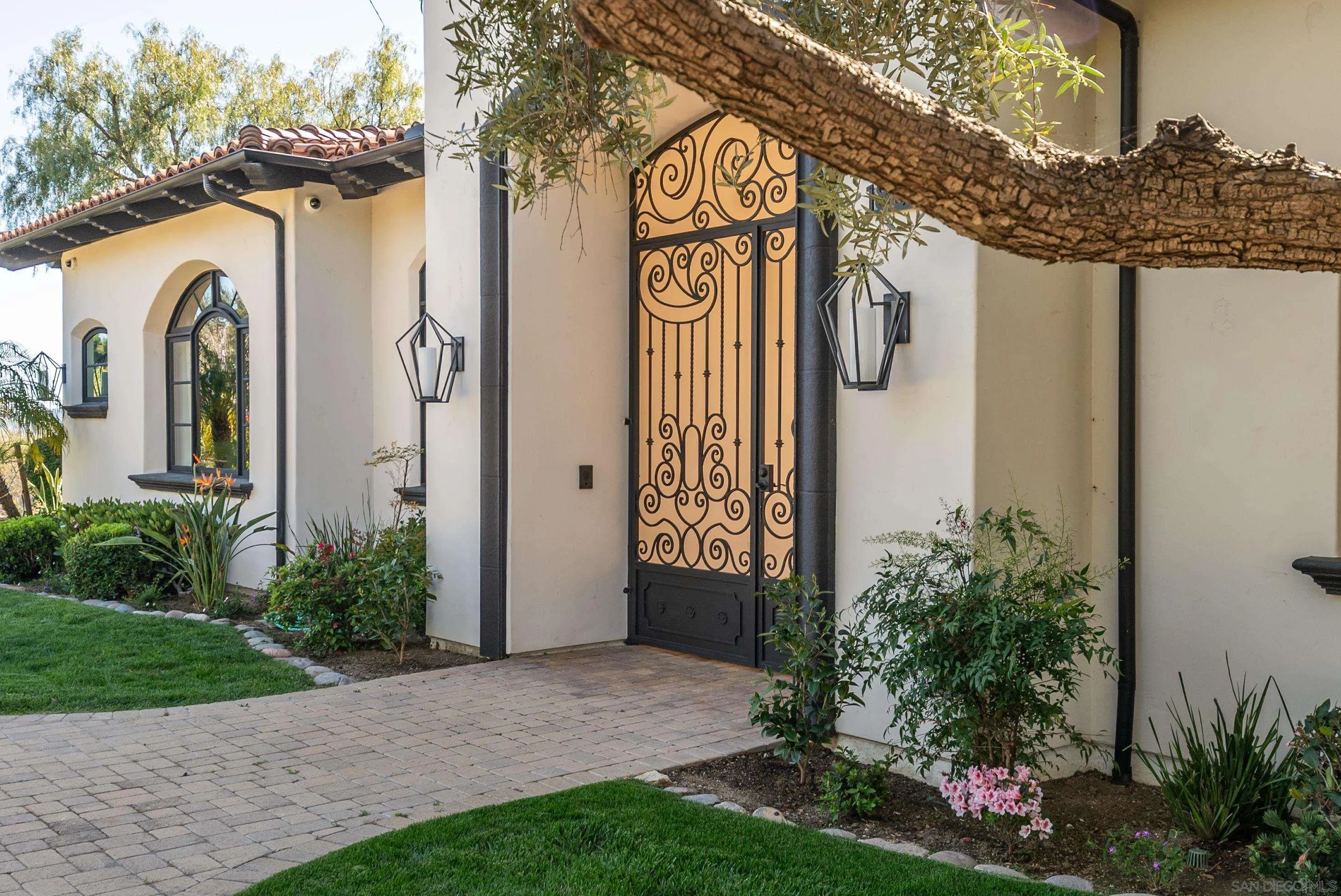 18650 Old Coach Way Poway, CA 92064 - Photo 2 of 63 a front view of a house with garden