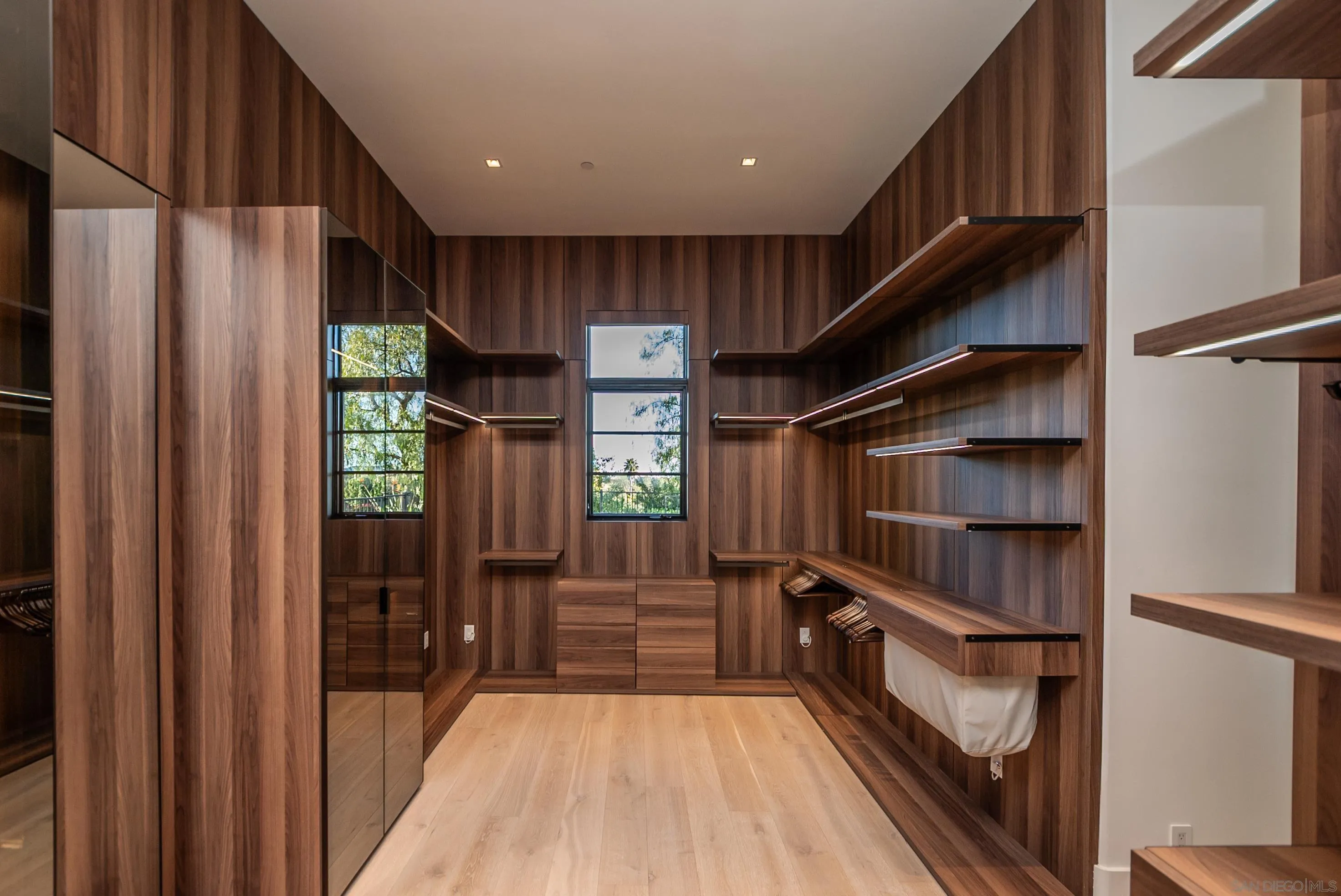 18650 Old Coach Way Poway, CA 92064 - Photo 35 of 63 a view of walk in closet with clothes and shoes