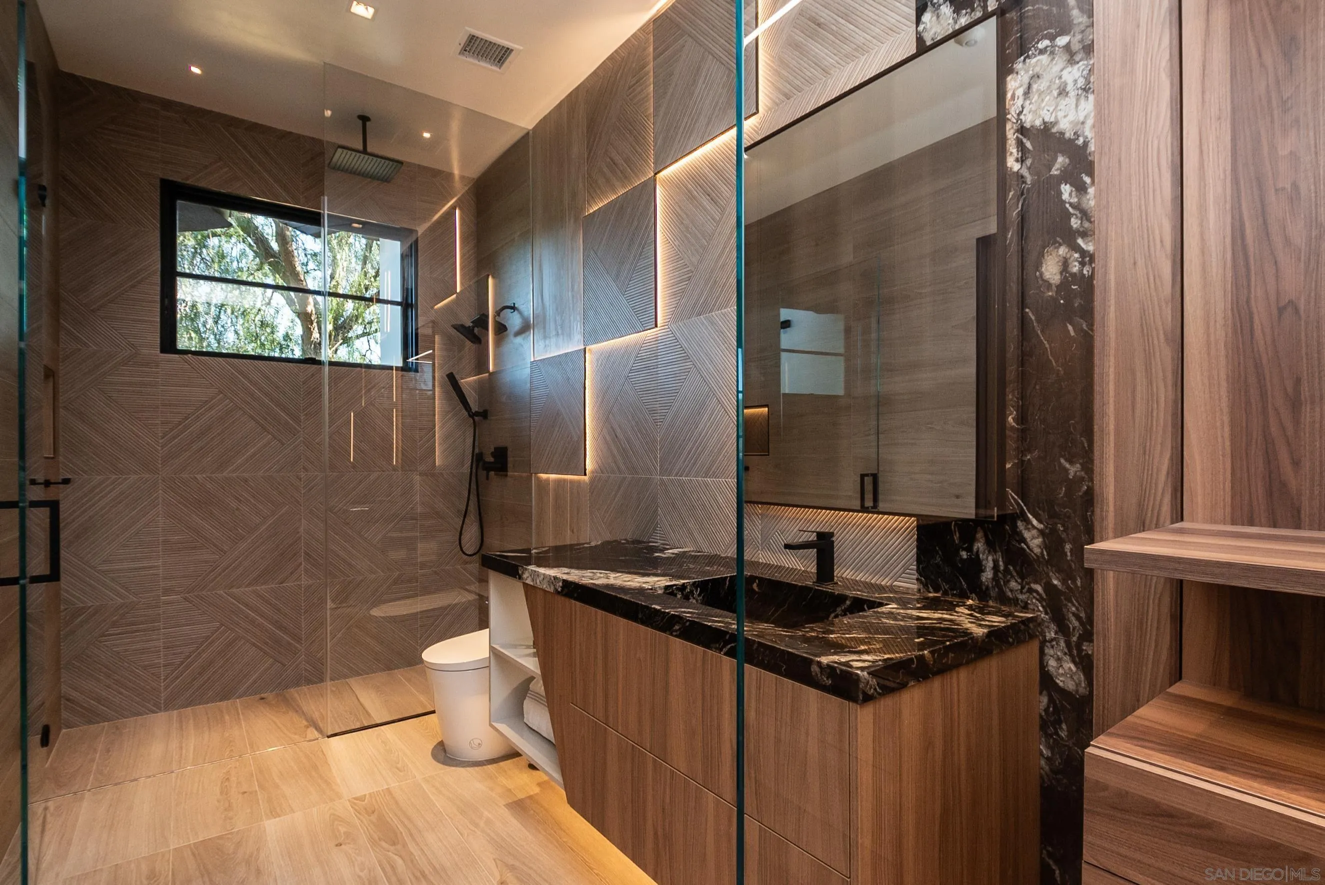18650 Old Coach Way Poway, CA 92064 - Photo 39 of 63 a bathroom with a granite countertop sink toilet and shower