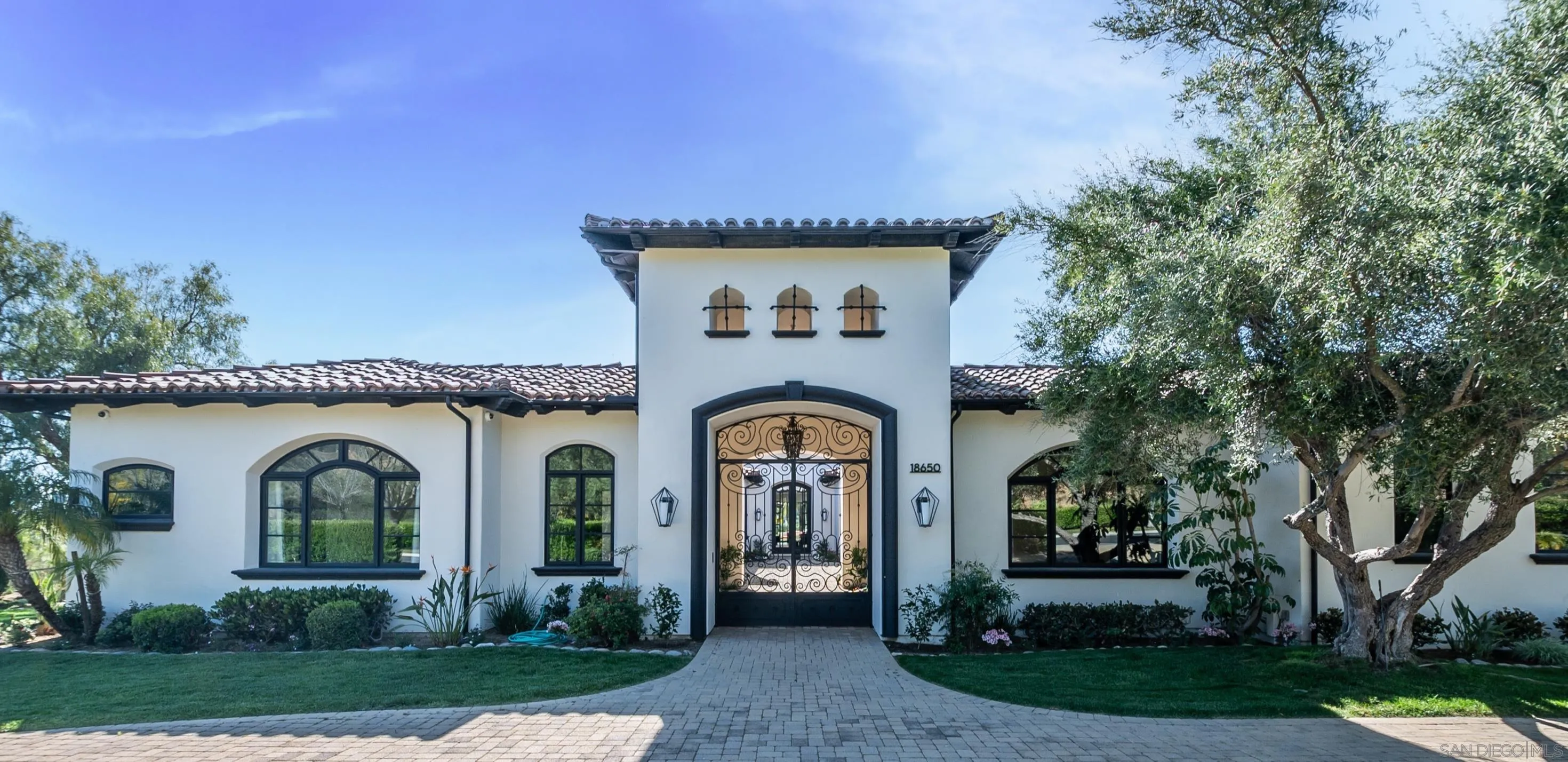 18650 Old Coach Way Poway, CA 92064 - Photo 60 of 63 a front view of a house with garden