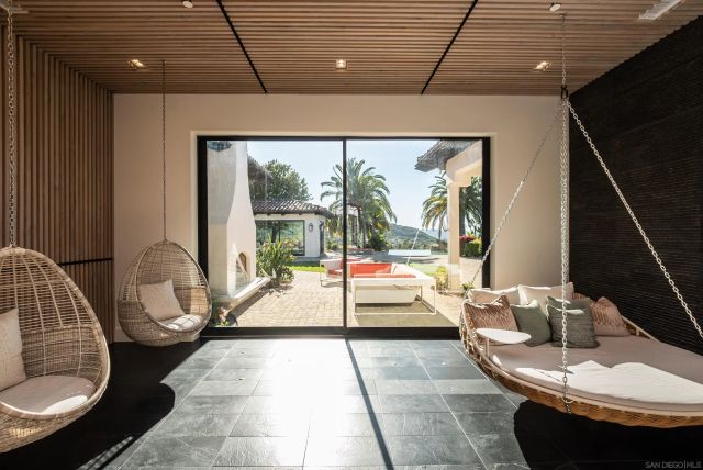 a lobby with furniture and a floor to ceiling window