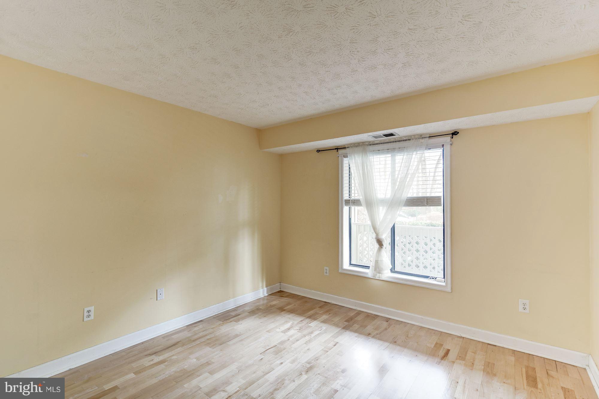 2224 Hunter's Run Drive, Unit 2224 Reston, VA 20191 - Photo 18 of 21 a view of an empty room with a window
