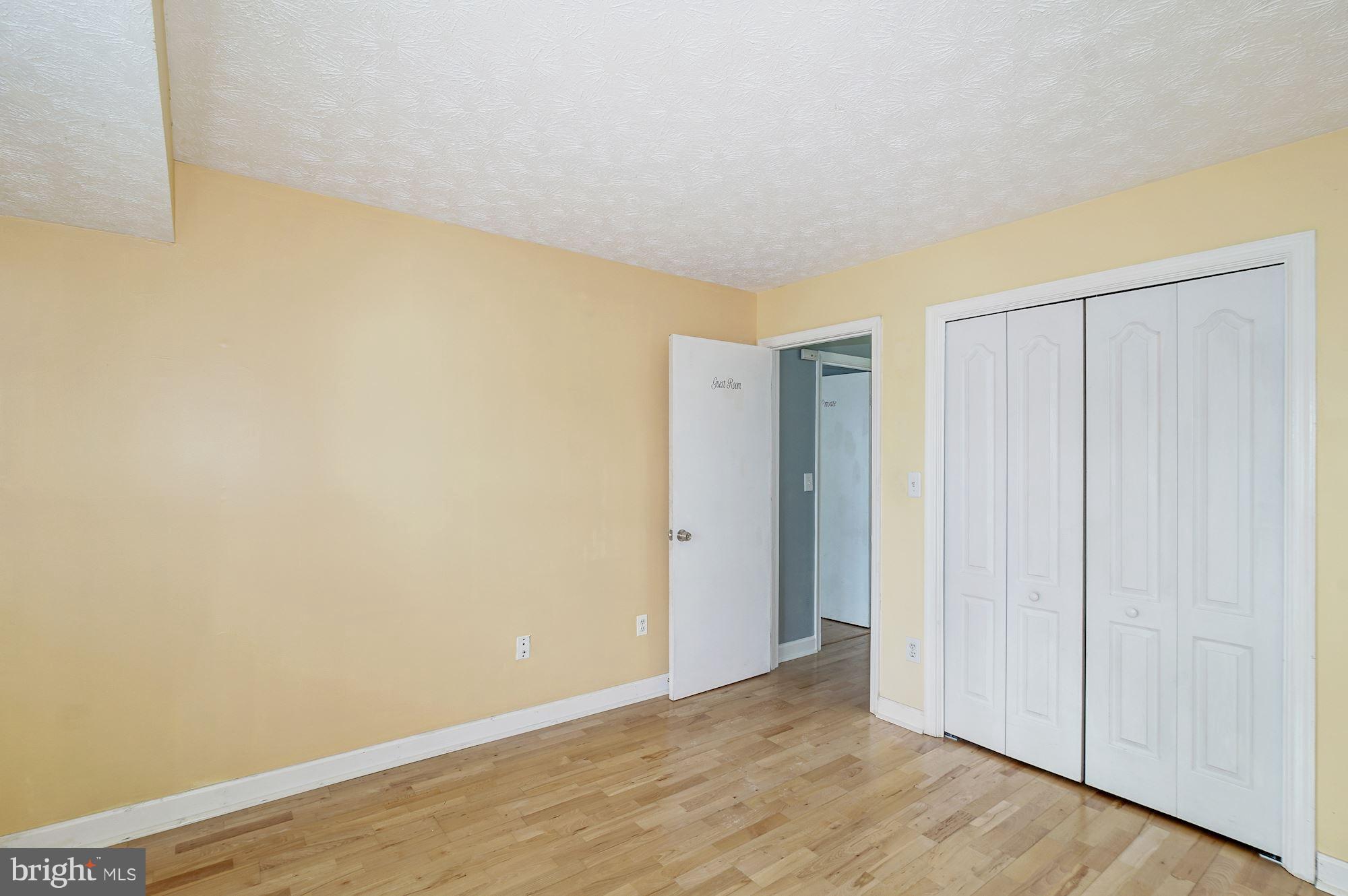 2224 Hunter's Run Drive, Unit 2224 Reston, VA 20191 - Photo 19 of 21 a view of an empty room and wooden floor
