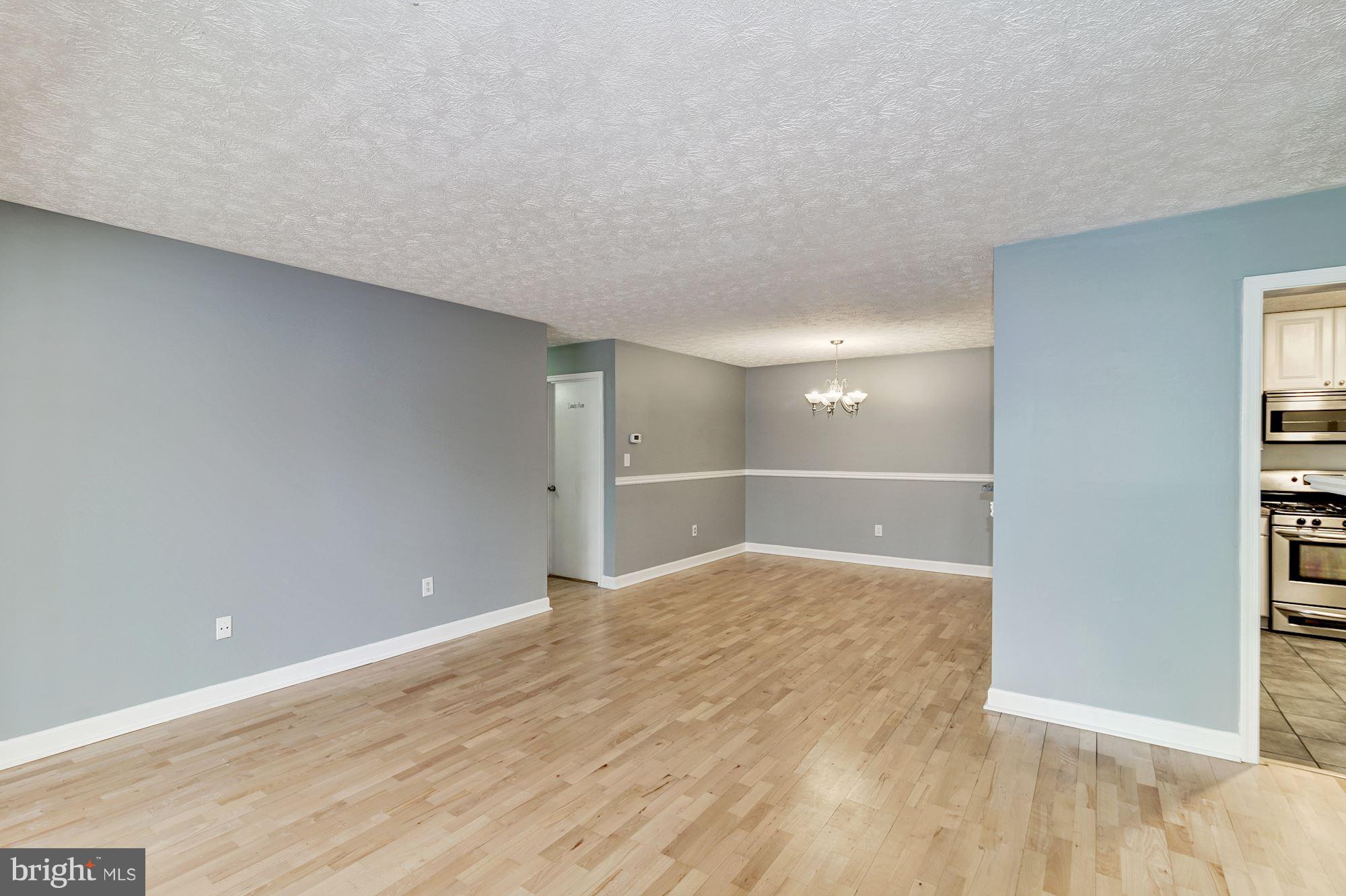 2224 Hunter's Run Drive, Unit 2224 Reston, VA 20191 - Photo 4 of 21 a view of an empty room and window