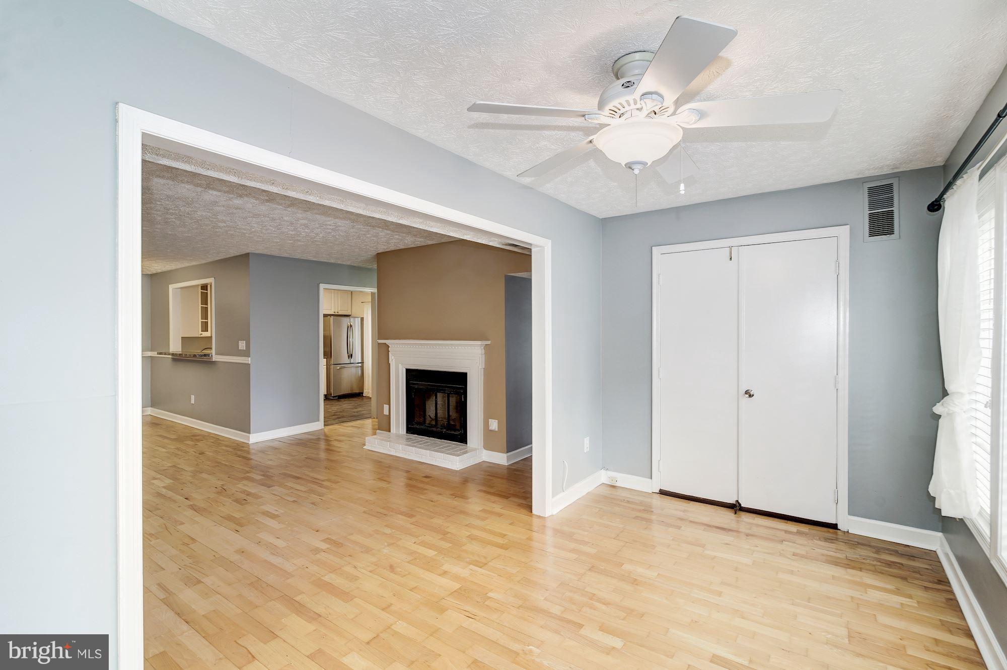 2224 Hunter's Run Drive, Unit 2224 Reston, VA 20191 - Photo 9 of 21 a view of an empty room with a fireplace