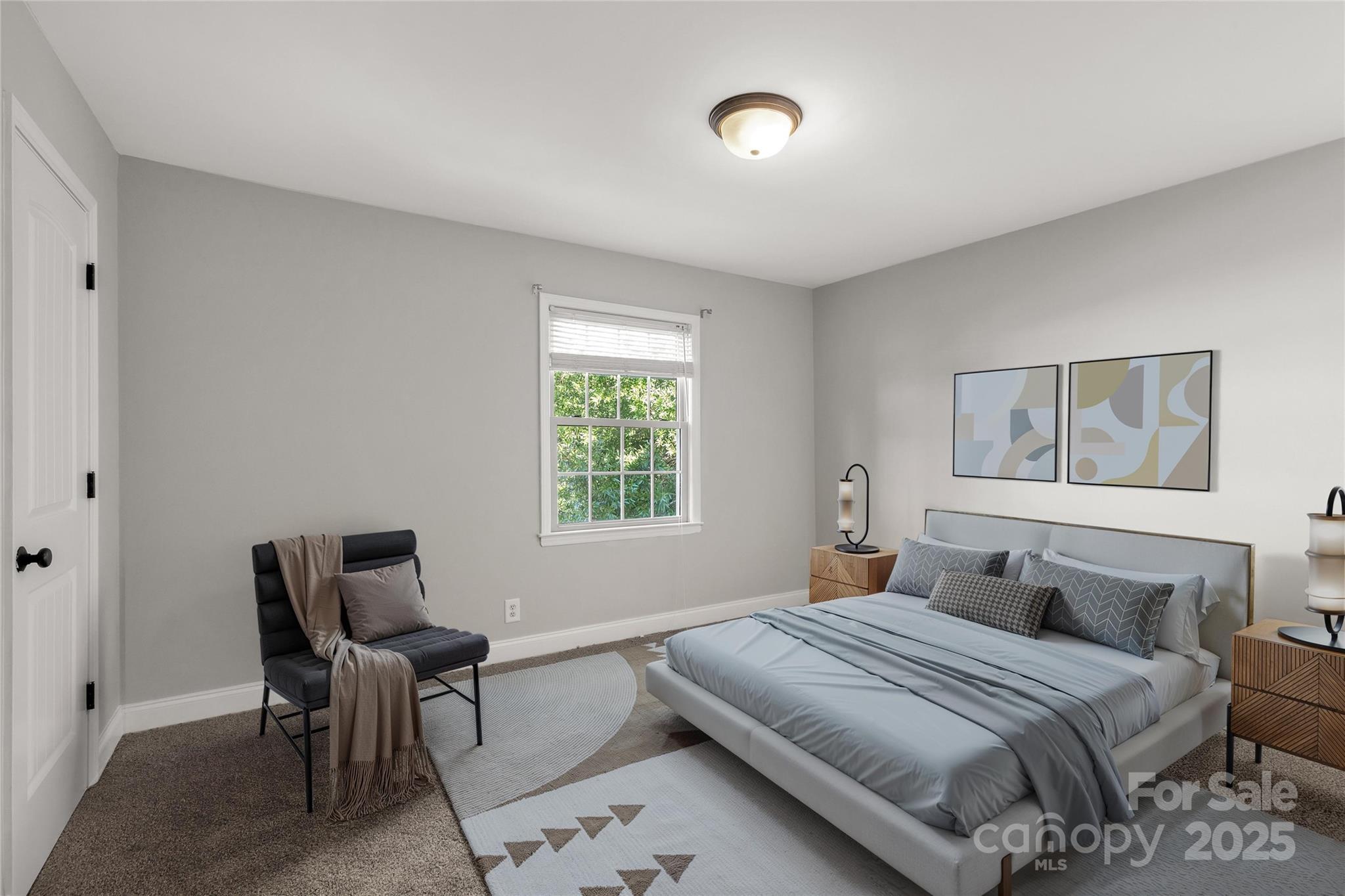 4923 Park Road, Unit E Charlotte, NC 28209 - Photo 12 of 24 a bedroom with a bed and a window