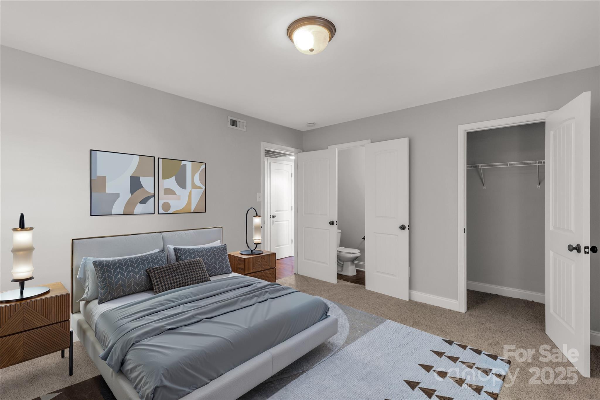 4923 Park Road, Unit E Charlotte, NC 28209 - Photo 13 of 24 a bedroom with a bed and a view of bathroom