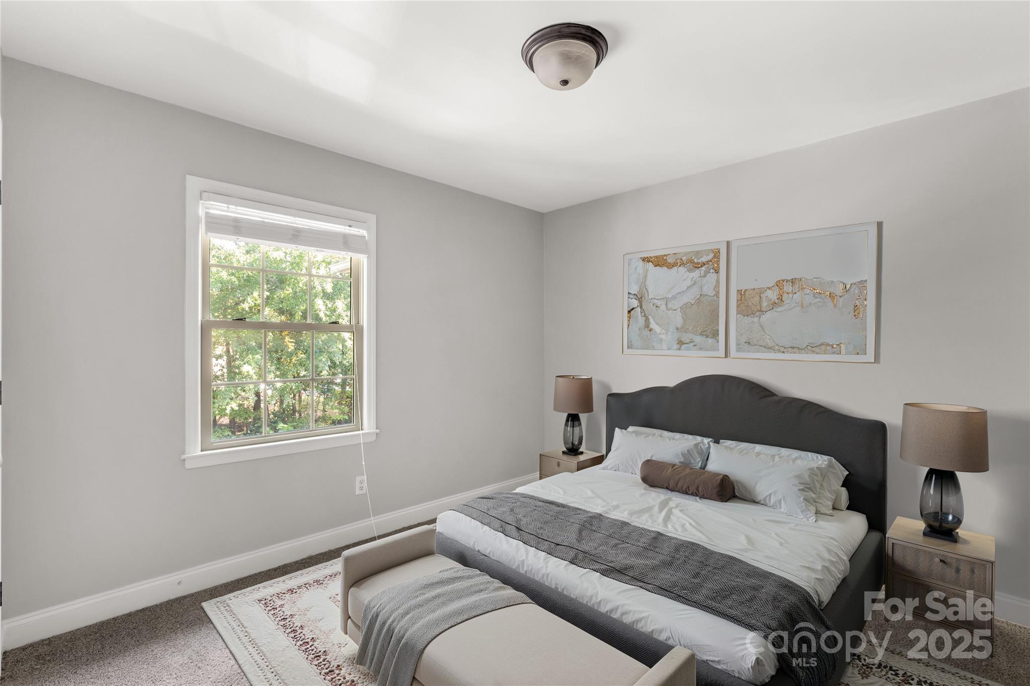 4923 Park Road, Unit E Charlotte, NC 28209 - Photo 15 of 24 a bedroom with a bed and wooden floor