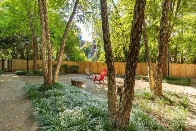a view of a backyard with sitting area