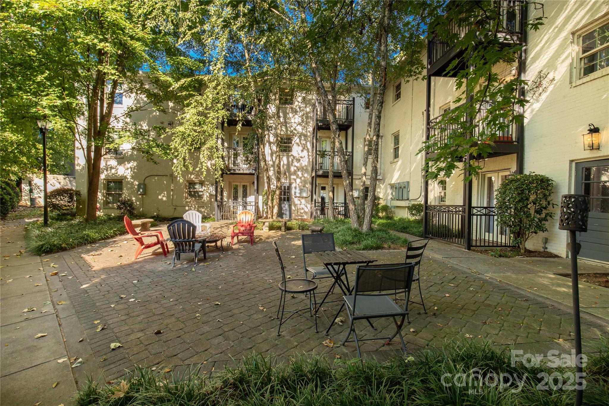 4923 Park Road, Unit E Charlotte, NC 28209 - Photo 17 of 24 a view of a backyard with sitting area