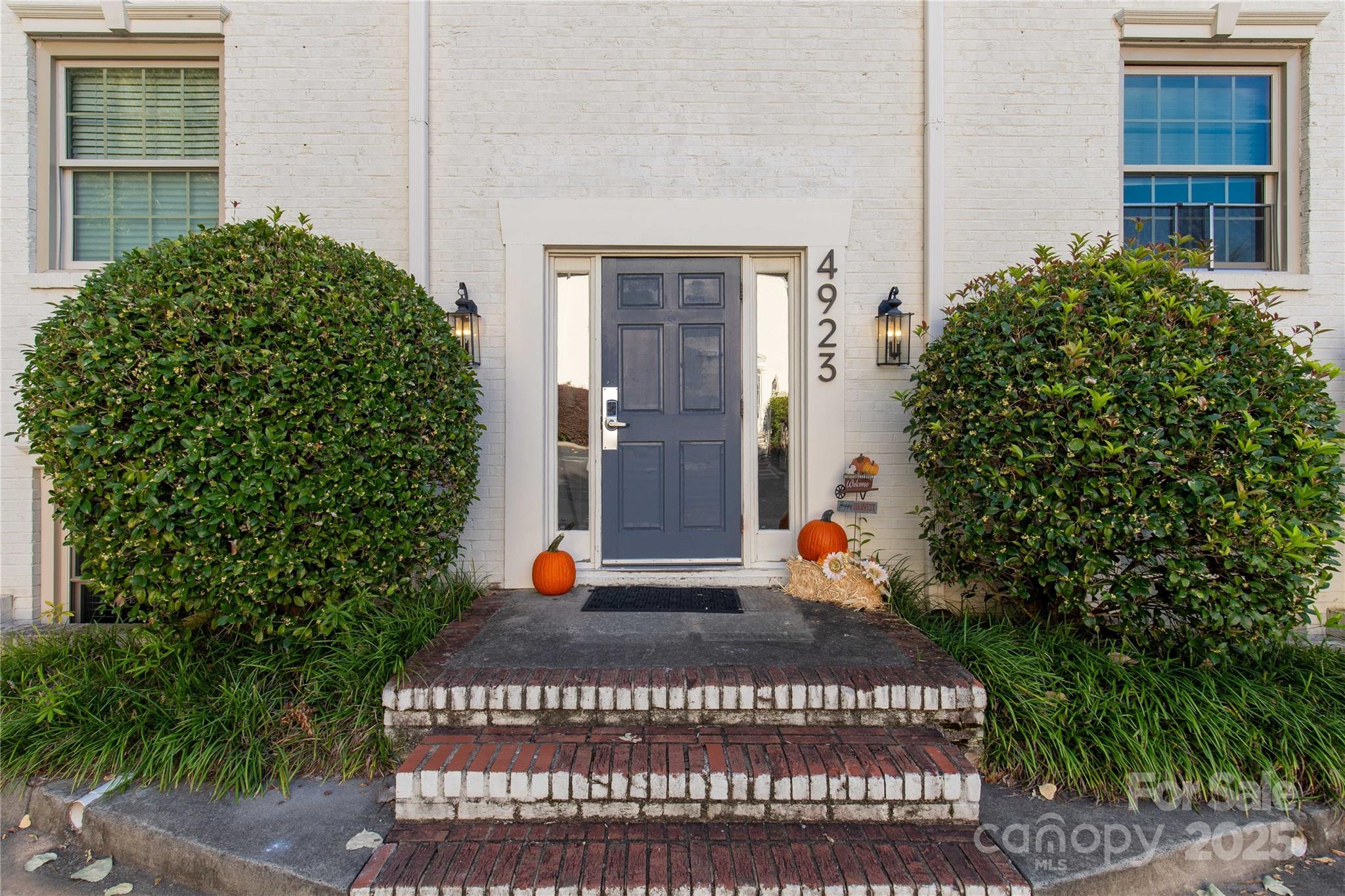 4923 Park Road, Unit E Charlotte, NC 28209 - Photo 20 of 24 a view of a building with potted plants