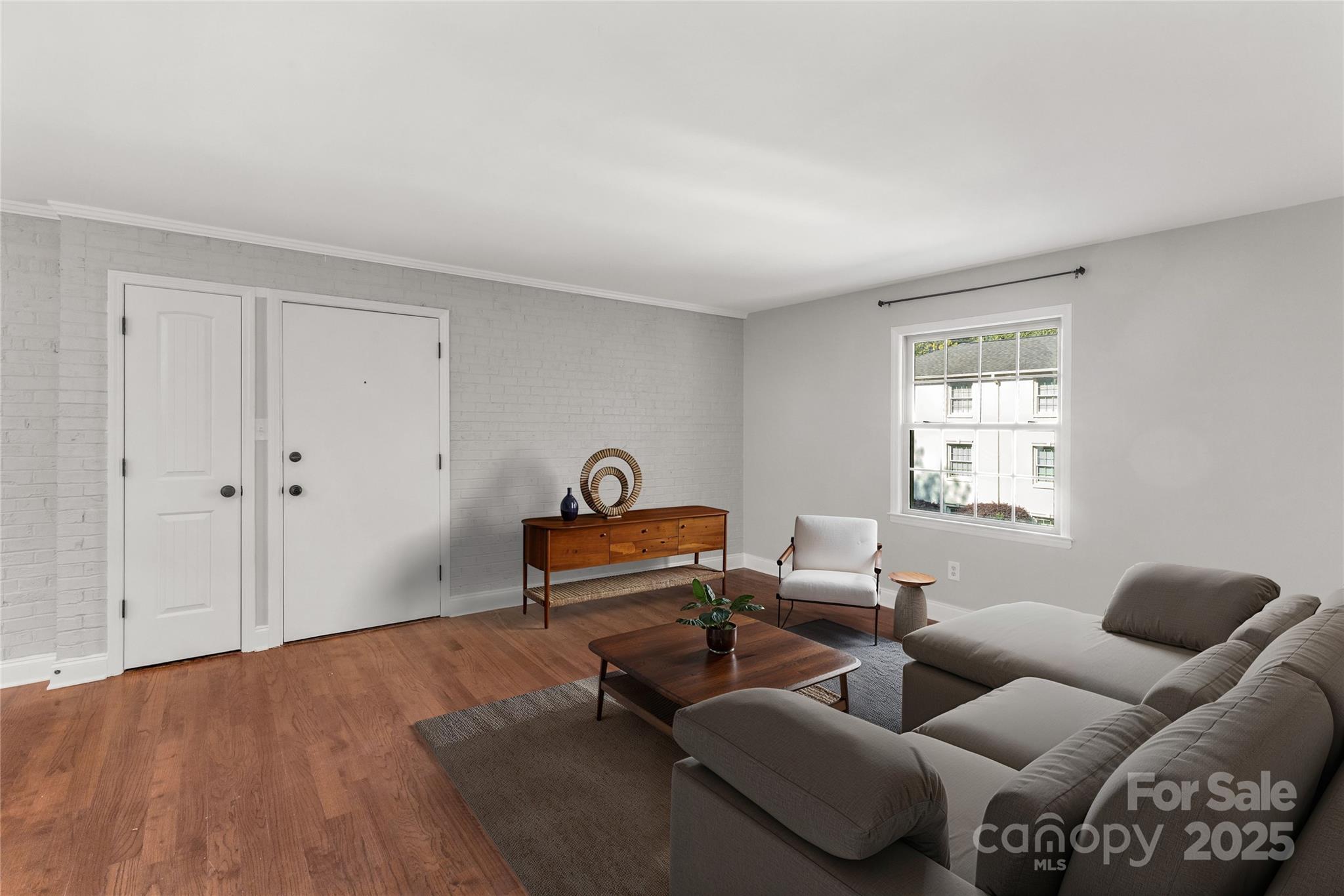 4923 Park Road, Unit E Charlotte, NC 28209 - Photo 10 of 24 a living room with furniture and a window