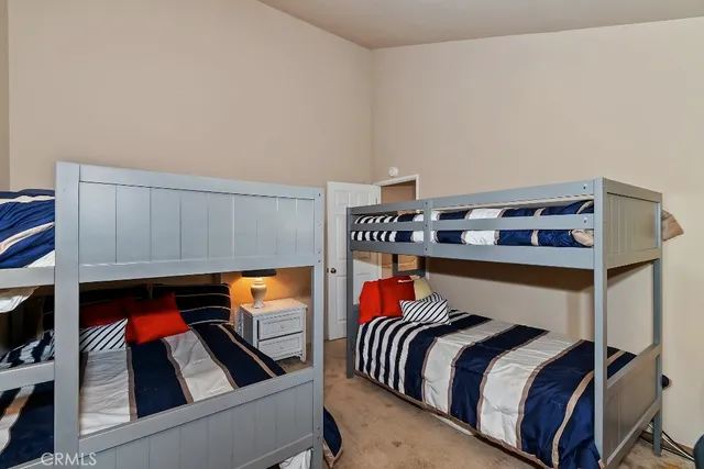 a bedroom with a bed and walk in closet