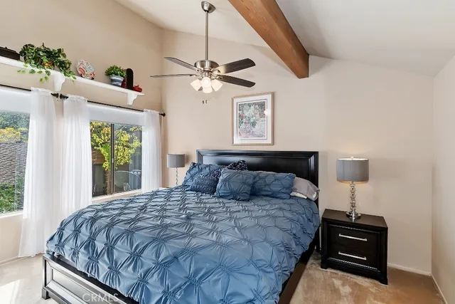 a bedroom with a large bed and a window