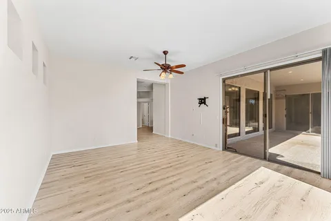 a view of room with window and wooden floor