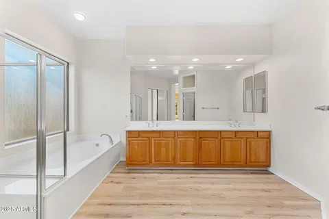 a bathroom with a sink toilet and a mirror
