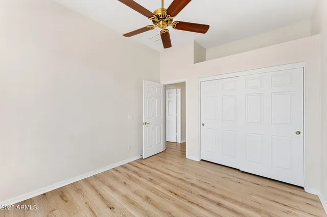 a view of room with window and wooden floor