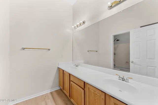 a kitchen with stainless steel appliances granite countertop white cabinets and a window