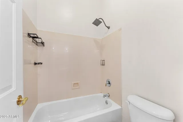 a bathroom with a sink toilet and a mirror