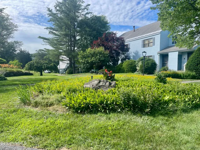 a kitchen with stainless steel appliances granite countertop a refrigerator and a stove