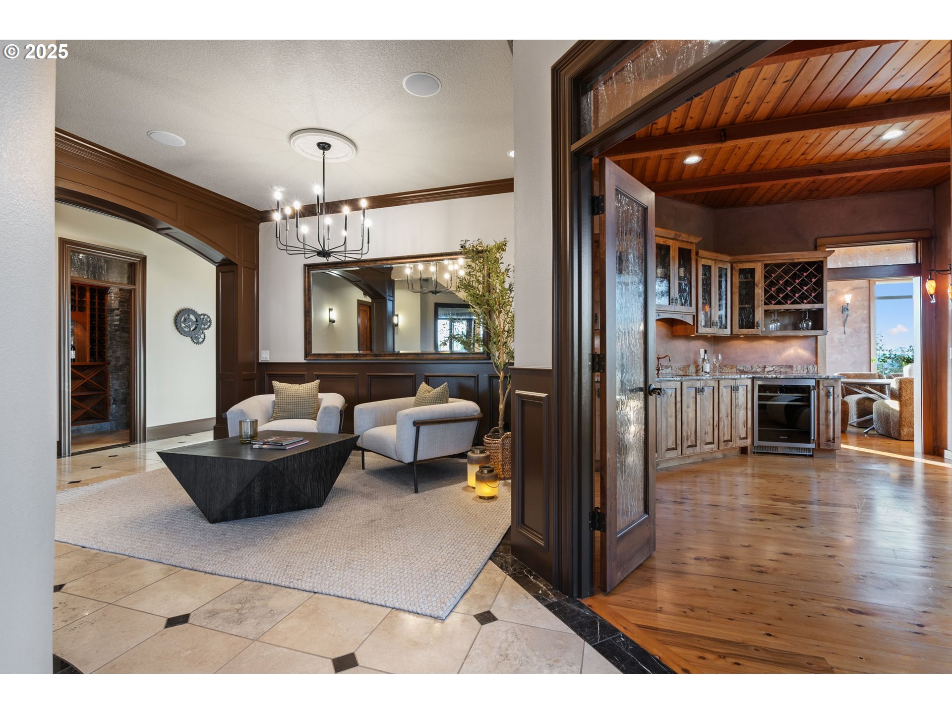 33302 Northwest 47th Court Ridgefield, WA 98642 - Photo 20 of 48 a living room with furniture and a chandelier