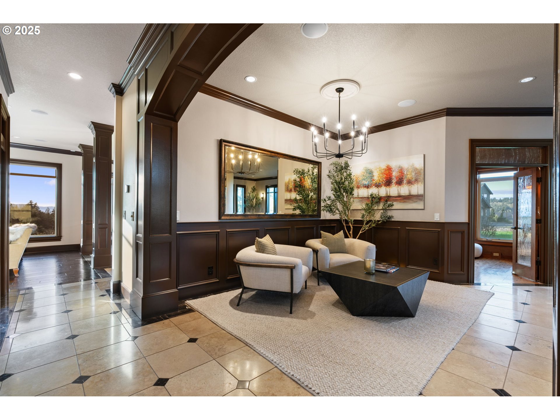 33302 Northwest 47th Court Ridgefield, WA 98642 - Photo 22 of 48 a living room with furniture a chandelier and a dining table