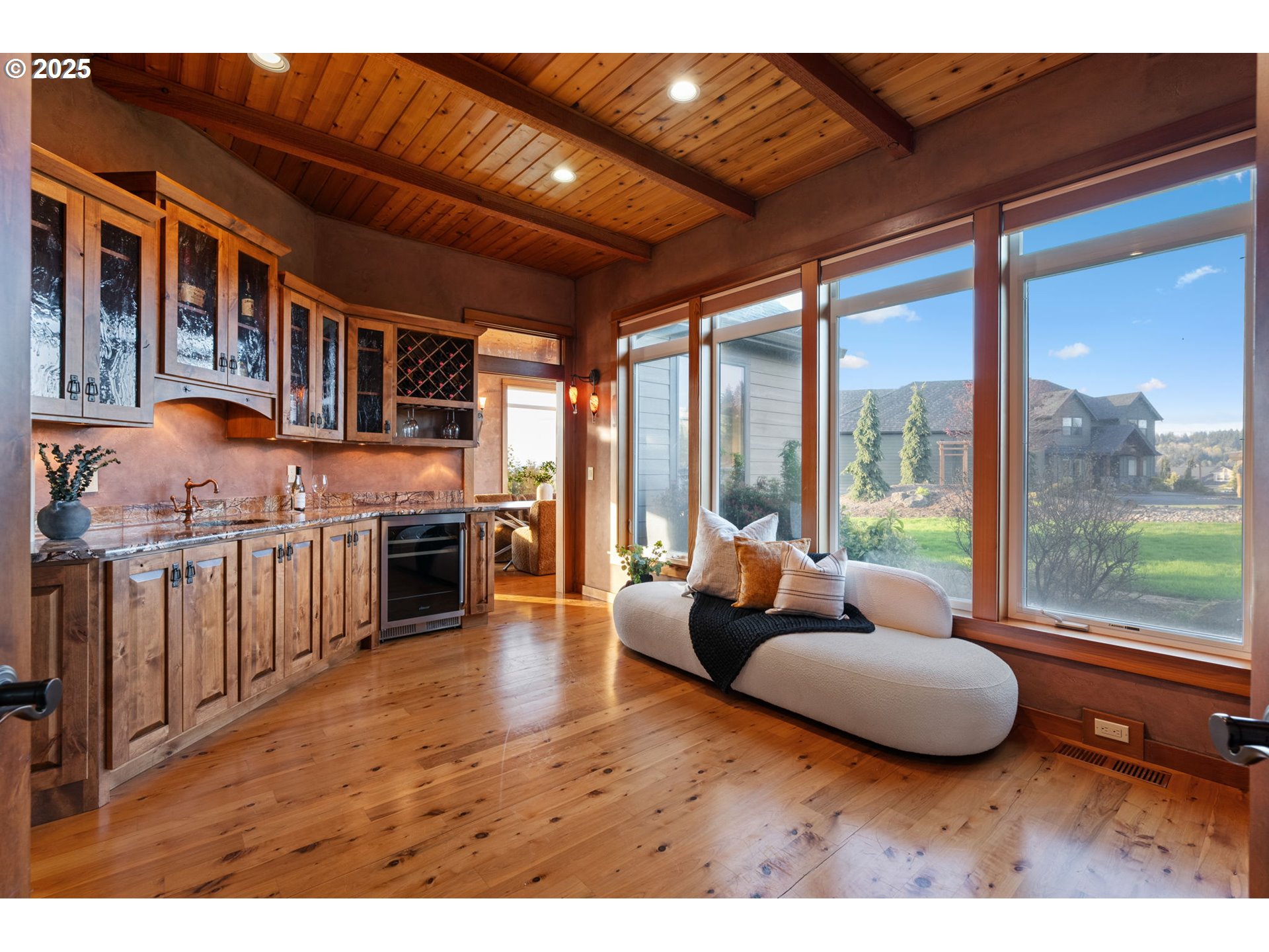 33302 Northwest 47th Court Ridgefield, WA 98642 - Photo 25 of 48 a living room with furniture and a floor to ceiling window