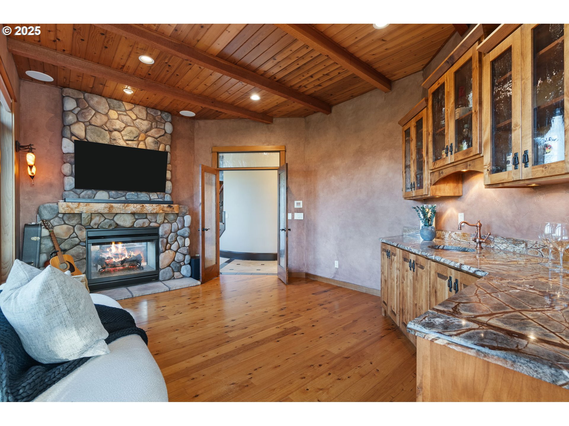 33302 Northwest 47th Court Ridgefield, WA 98642 - Photo 26 of 48 a living room with furniture and a flat screen tv