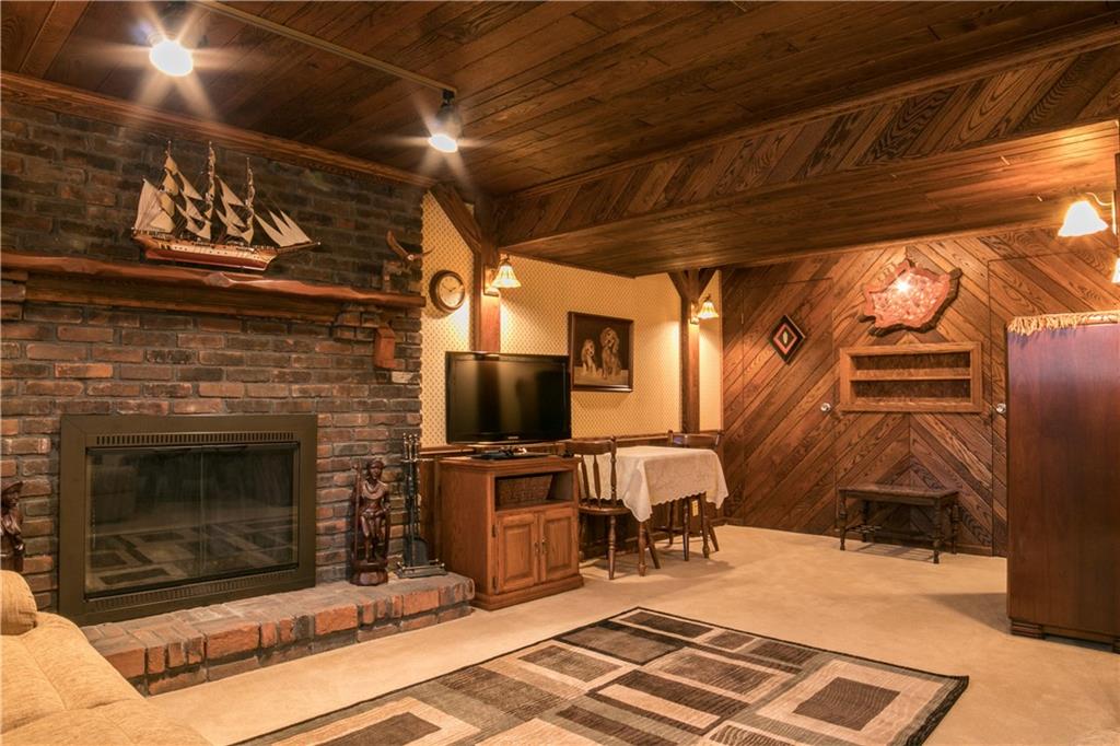 6371 Kemerer Hollow Road Export, PA 15632 - Photo 19 of 24 lower level gameroom with wood burning fireplace