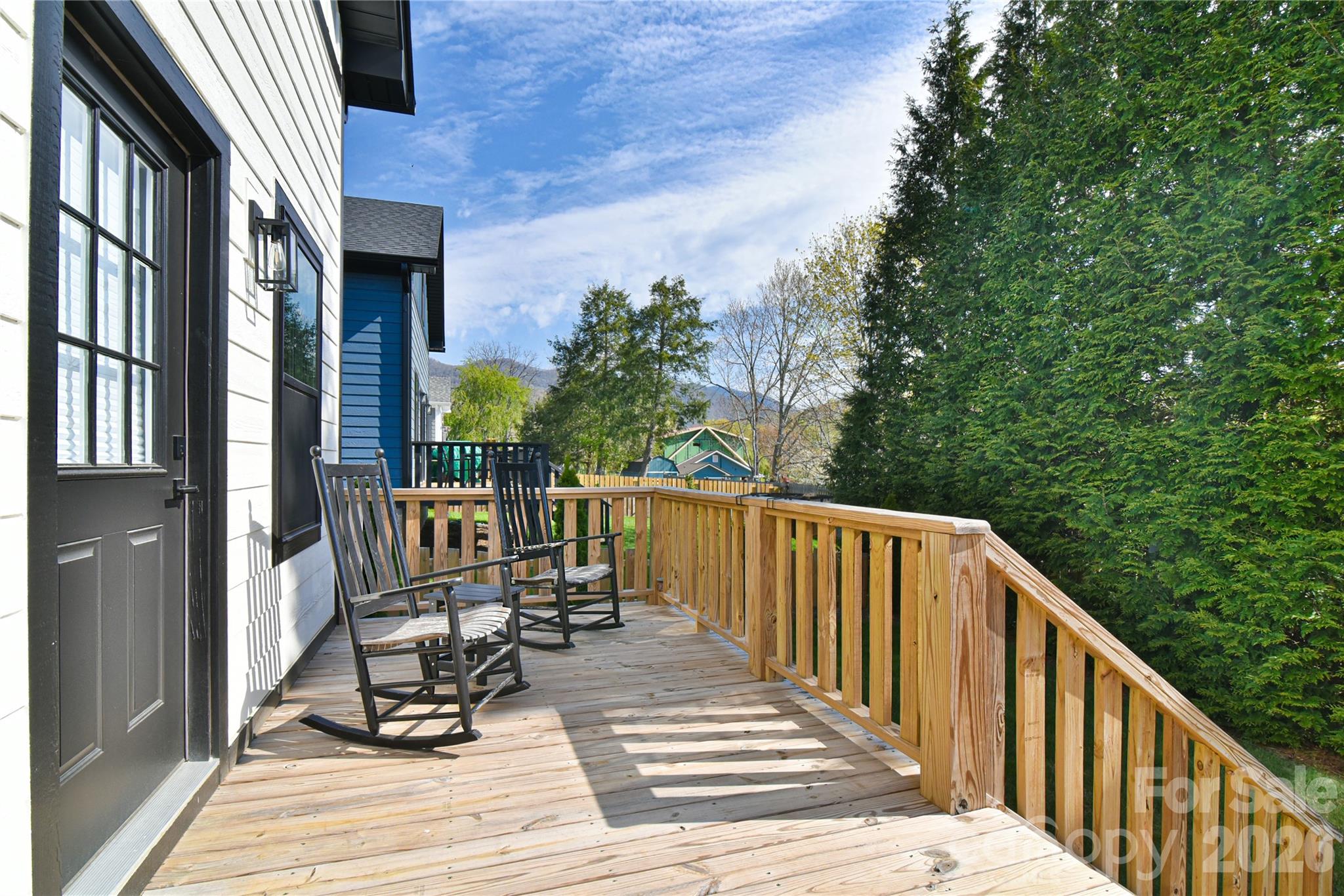 310 Portmanvilla Road Black Mountain, NC 28711 - Photo 13 of 30 a view of balcony with chairs and wooden fence