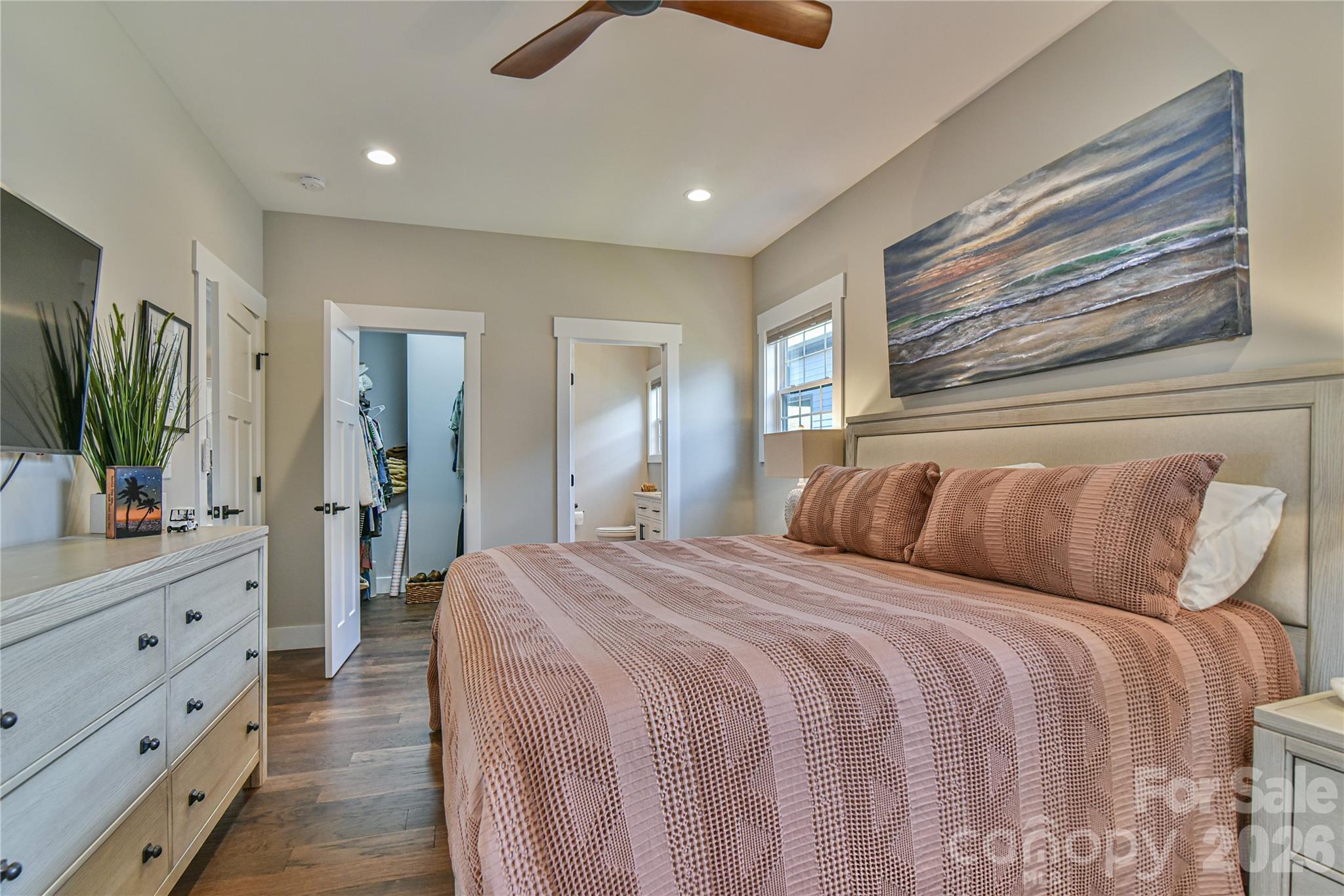 310 Portmanvilla Road Black Mountain, NC 28711 - Photo 16 of 30 a bedroom with a large bed and a flat tv screen on dresser