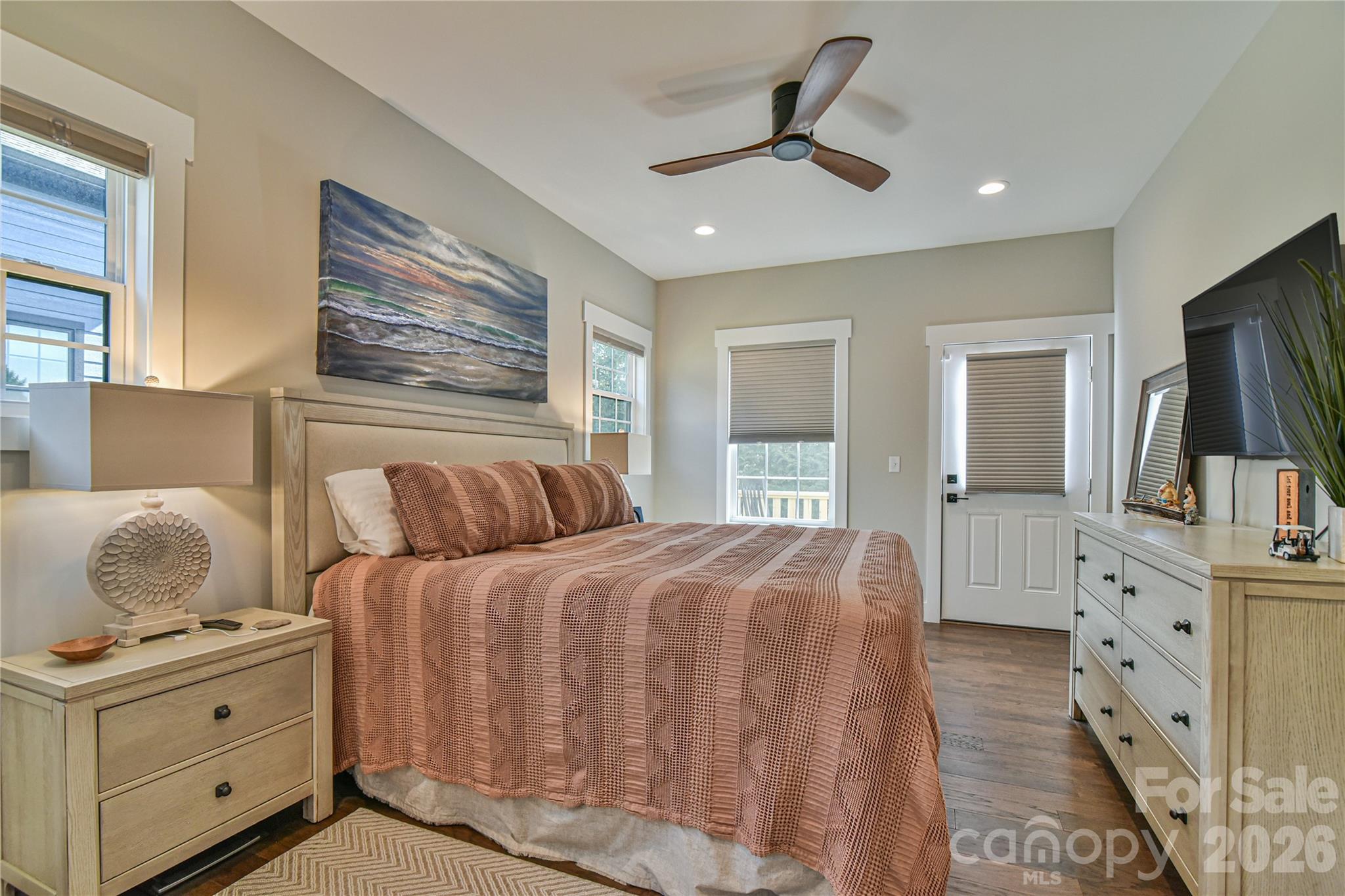310 Portmanvilla Road Black Mountain, NC 28711 - Photo 17 of 30 a bedroom with a large bed and a flat screen tv