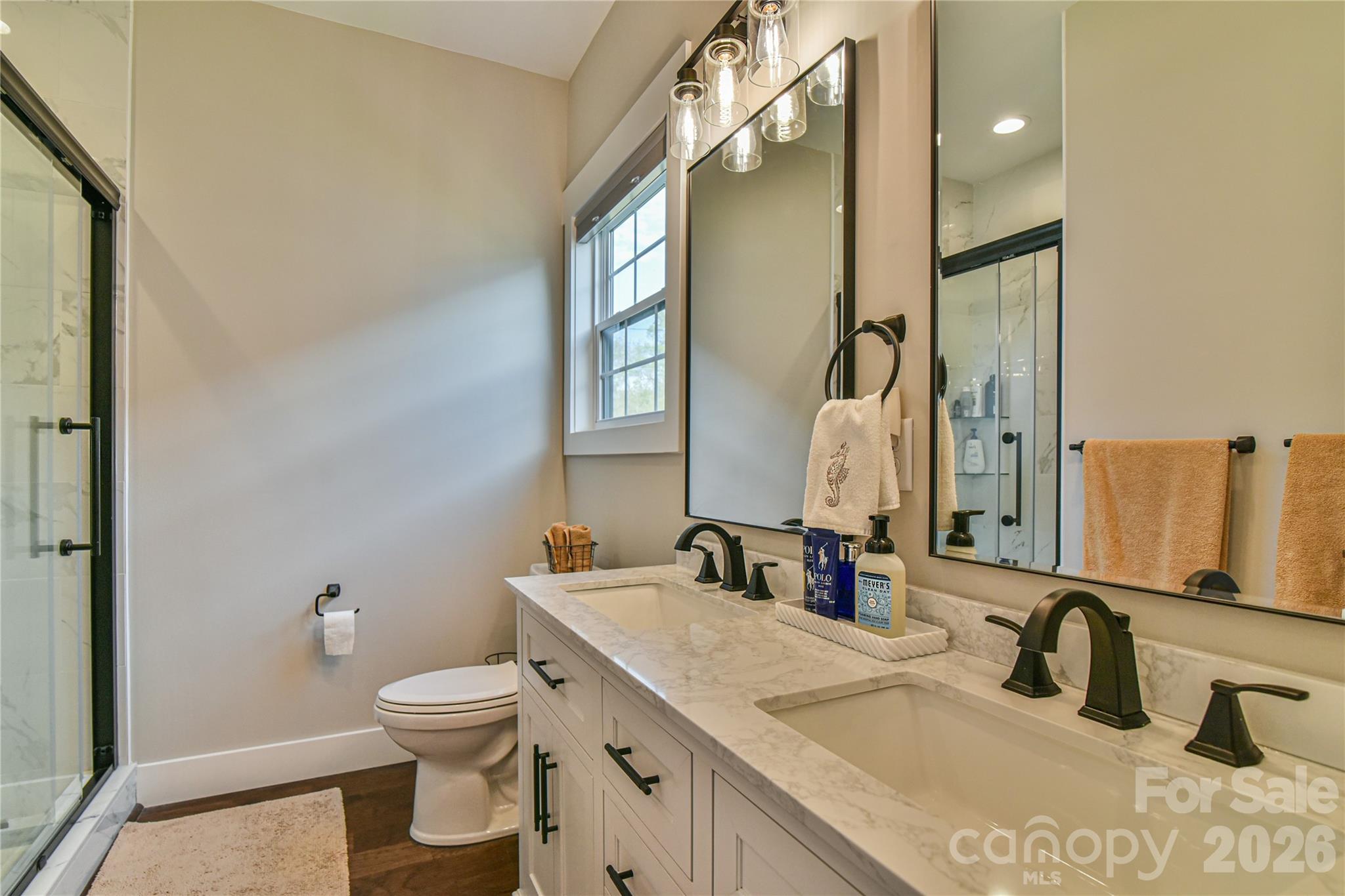 310 Portmanvilla Road Black Mountain, NC 28711 - Photo 18 of 30 a bathroom with a granite countertop sink toilet and shower