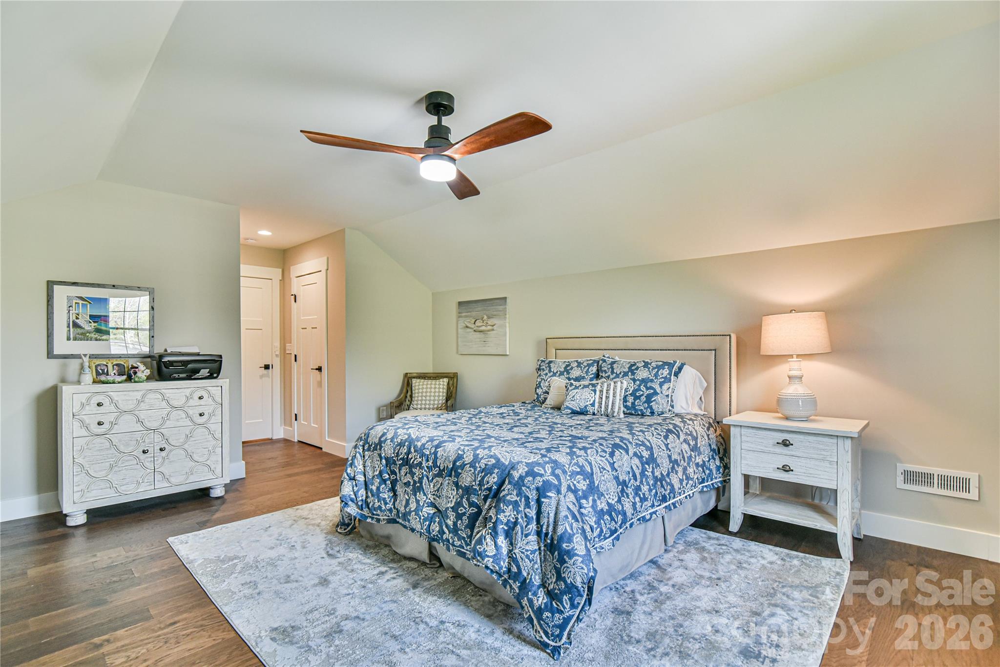 310 Portmanvilla Road Black Mountain, NC 28711 - Photo 28 of 30 a bedroom with a bed and a chandelier