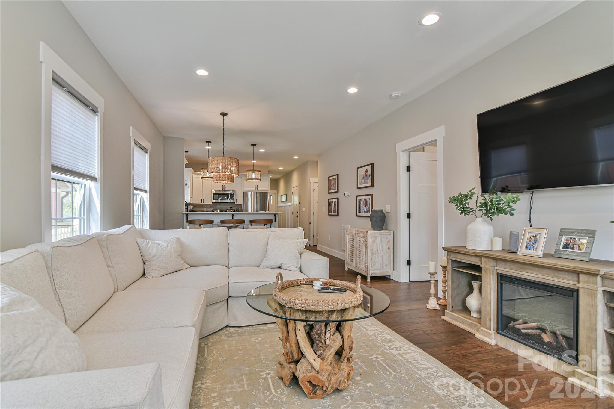 310 Portmanvilla Road Black Mountain, NC 28711 - Photo 3 of 30 a living room with furniture a flat screen tv and a fireplace