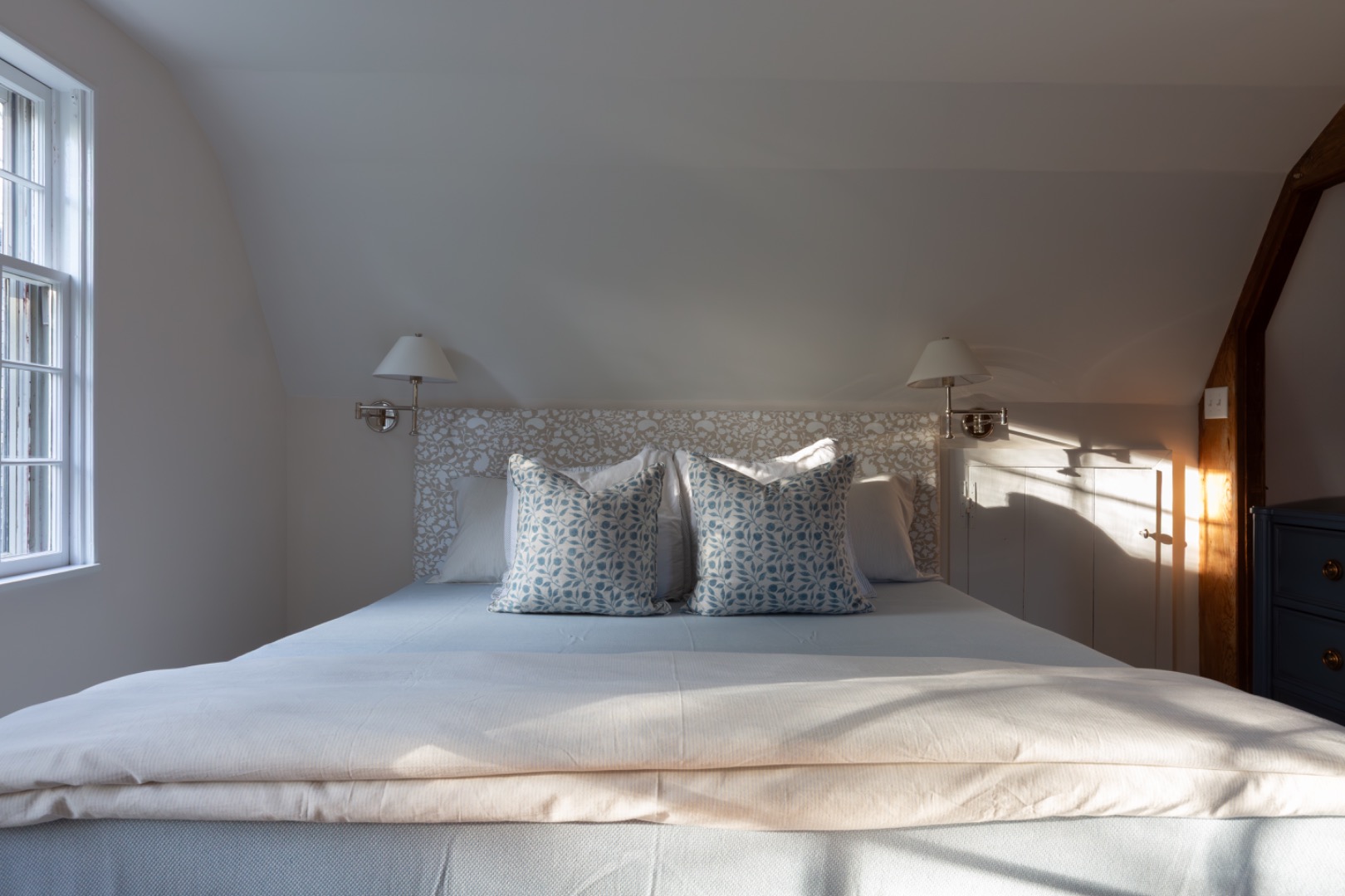 24 Milk Street Nantucket, MA 02554 - Photo 29 of 39 a large bed sitting in a bedroom next to a window