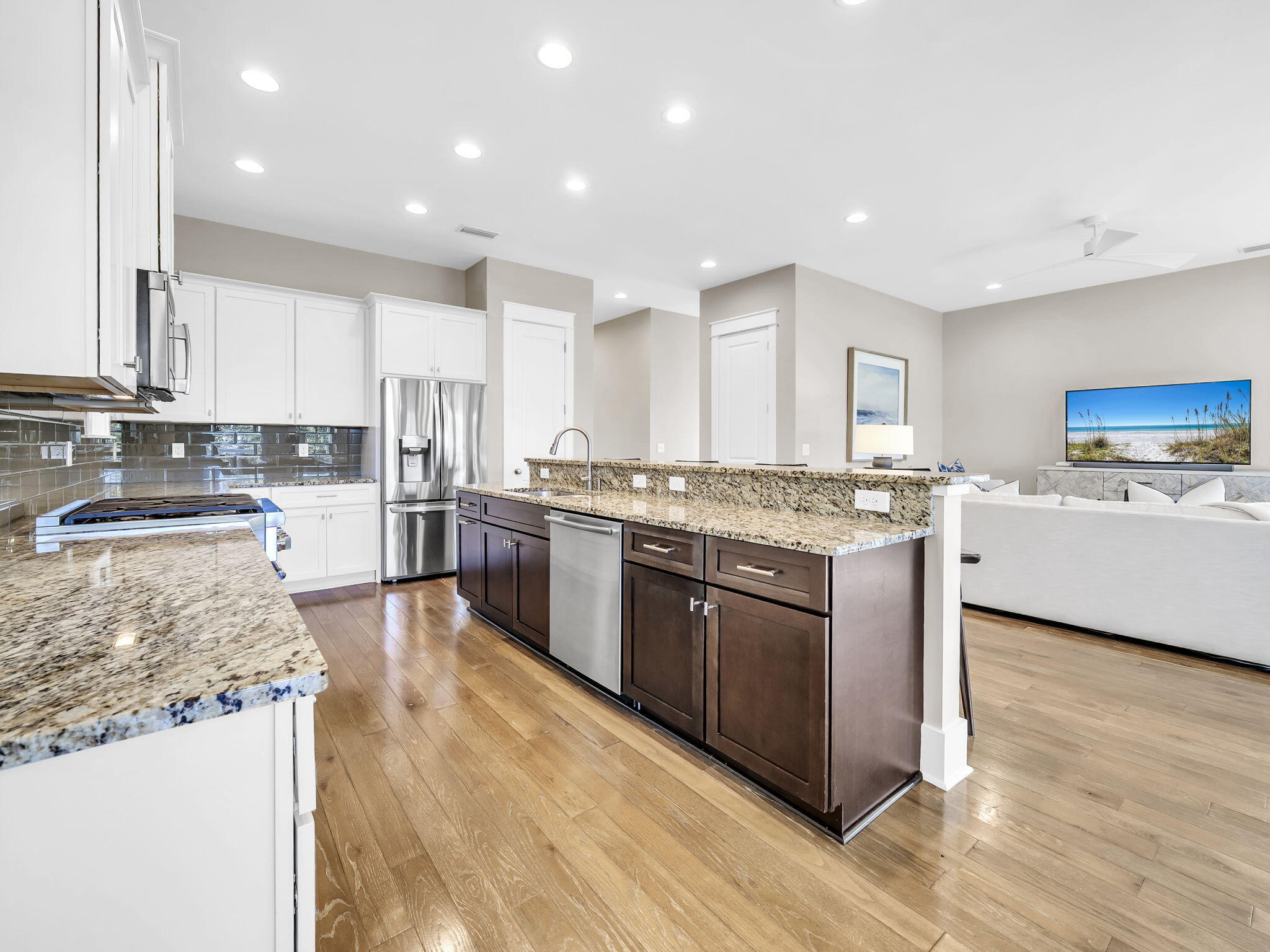 83 Cypress Walk Santa Rosa Beach, FL 32459 - Photo 30 of 77 a large kitchen with stainless steel appliances granite countertop a stove top oven a sink and white cabinets