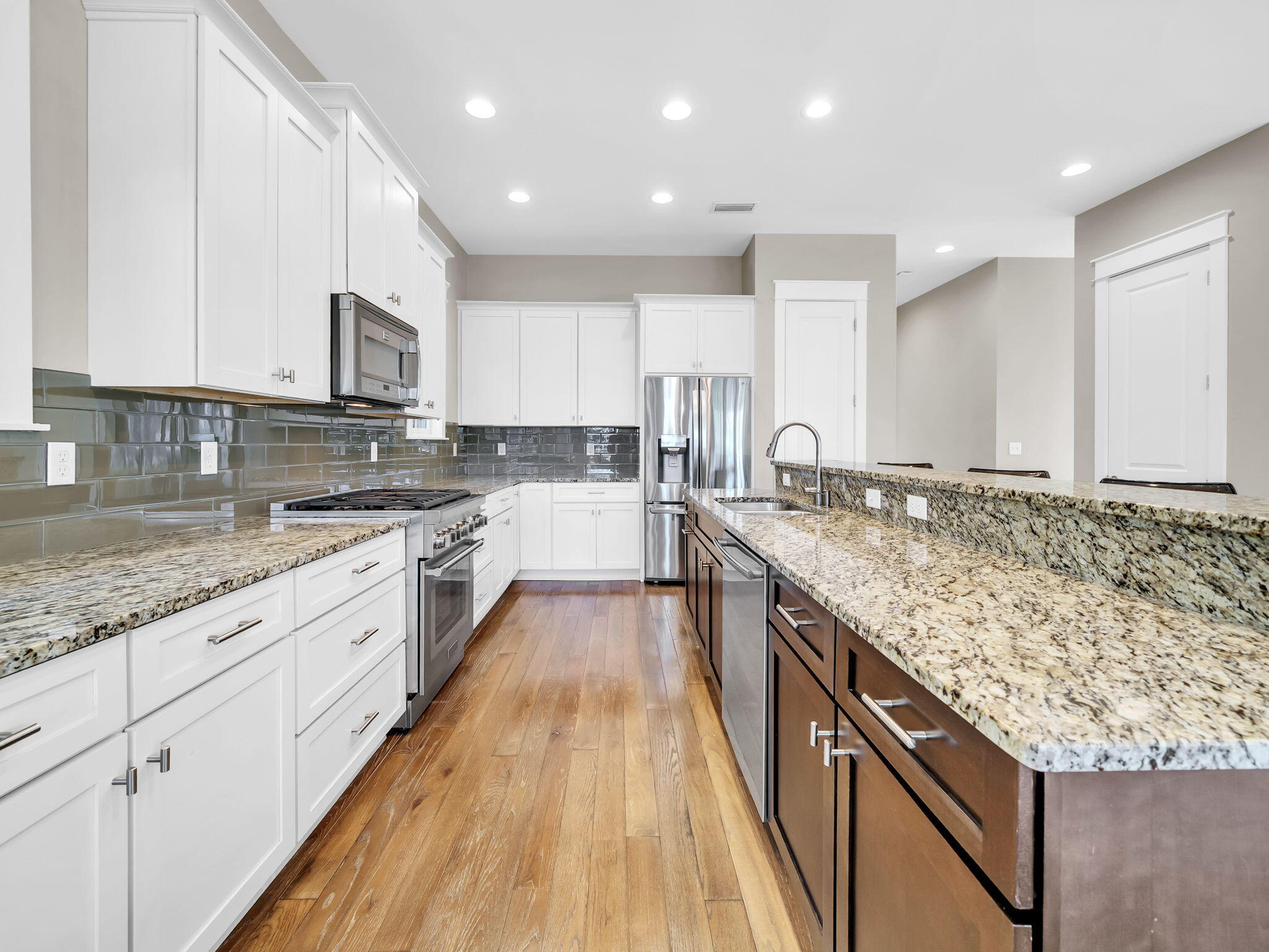83 Cypress Walk Santa Rosa Beach, FL 32459 - Photo 31 of 77 a large kitchen with granite countertop a large counter top and stainless steel appliances