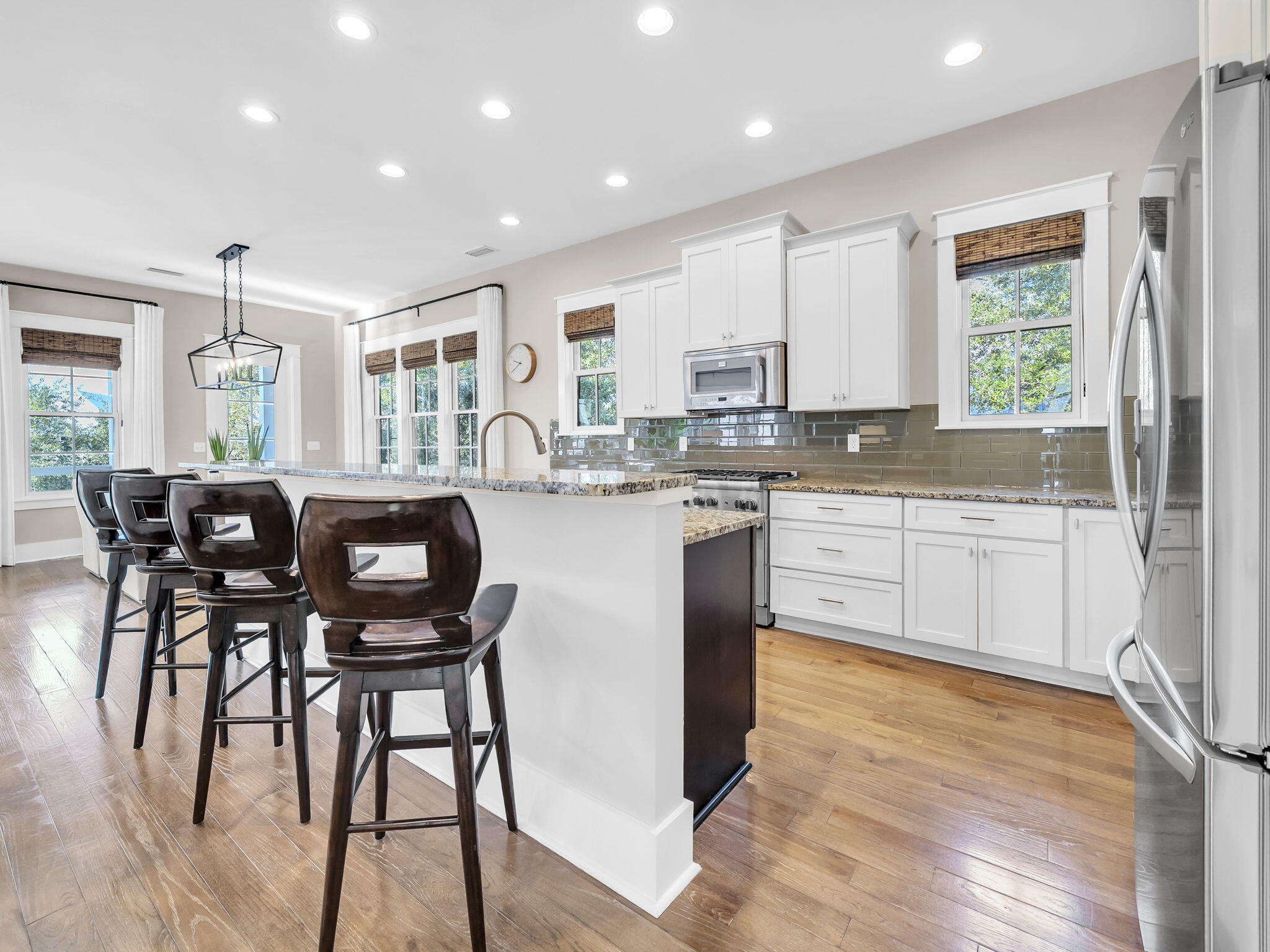 83 Cypress Walk Santa Rosa Beach, FL 32459 - Photo 33 of 77 a kitchen with stainless steel appliances granite countertop wooden cabinets a sink a stove a dining table and chairs