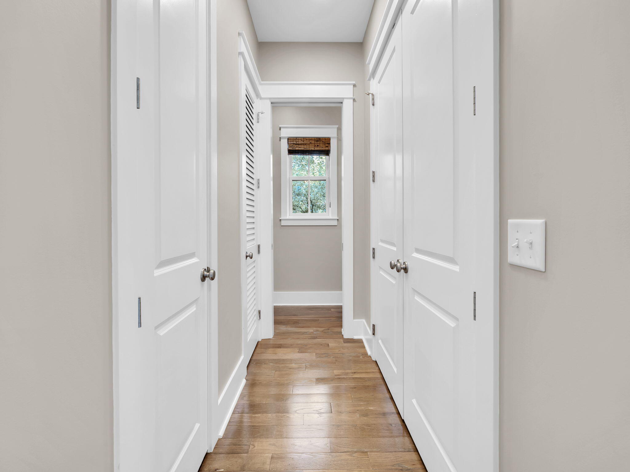 83 Cypress Walk Santa Rosa Beach, FL 32459 - Photo 35 of 77 a view of a hallway with a wooden door