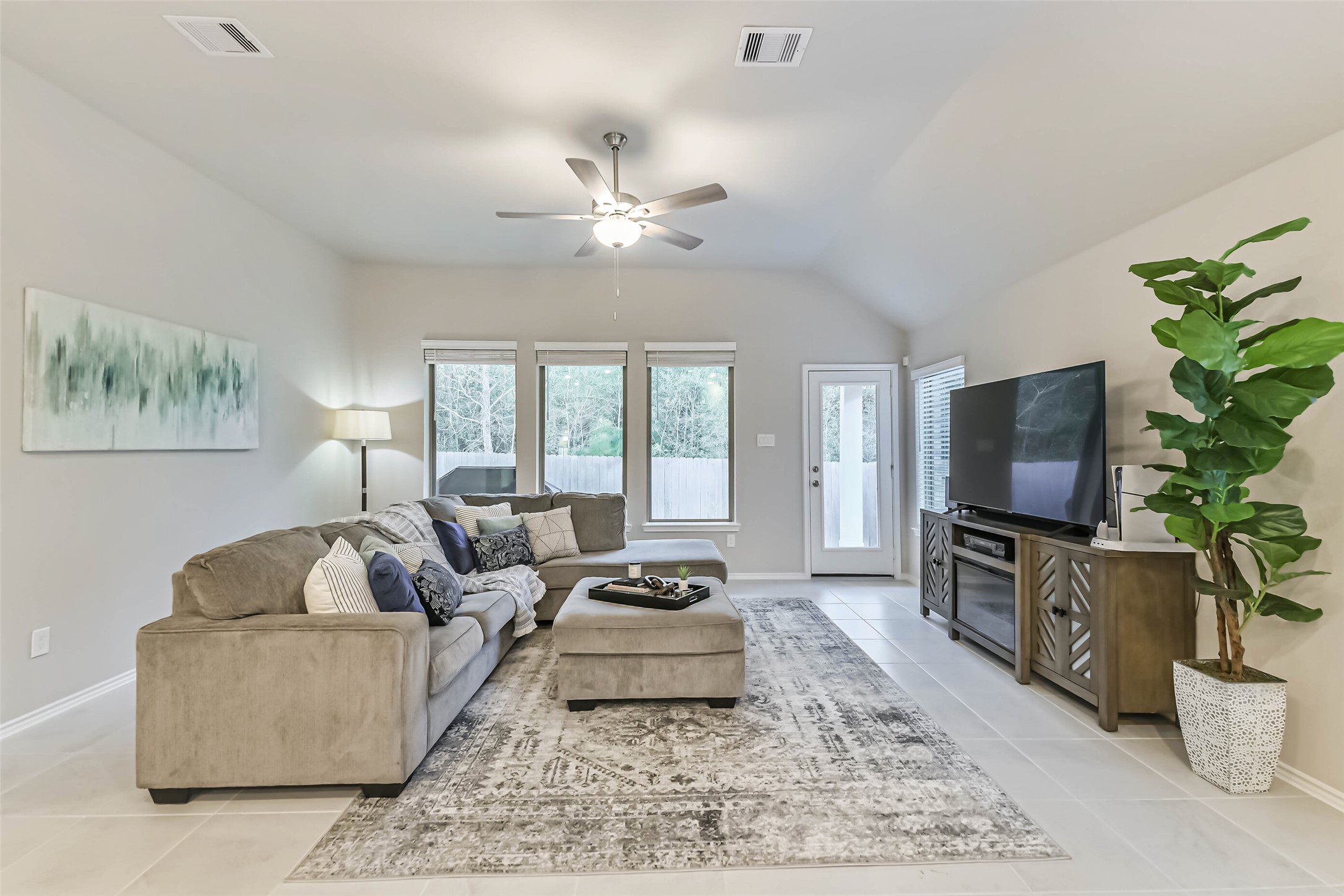 1337 Lakeside Crk Road Magnolia, TX 77354 - Photo 12 of 34 a living room with furniture and a flat screen tv