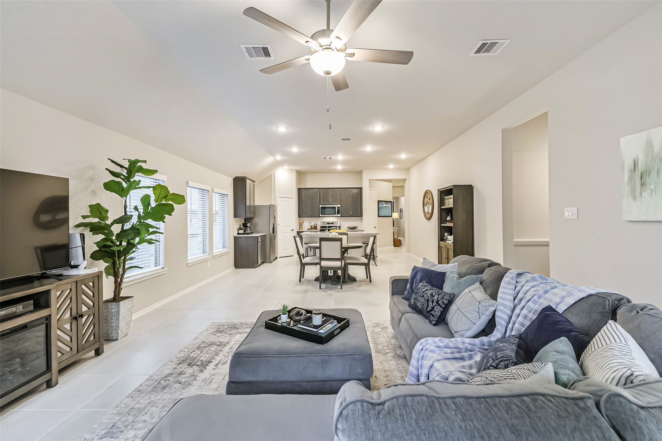 1337 Lakeside Crk Road Magnolia, TX 77354 - Photo 15 of 34 a living room with furniture and a flat screen tv