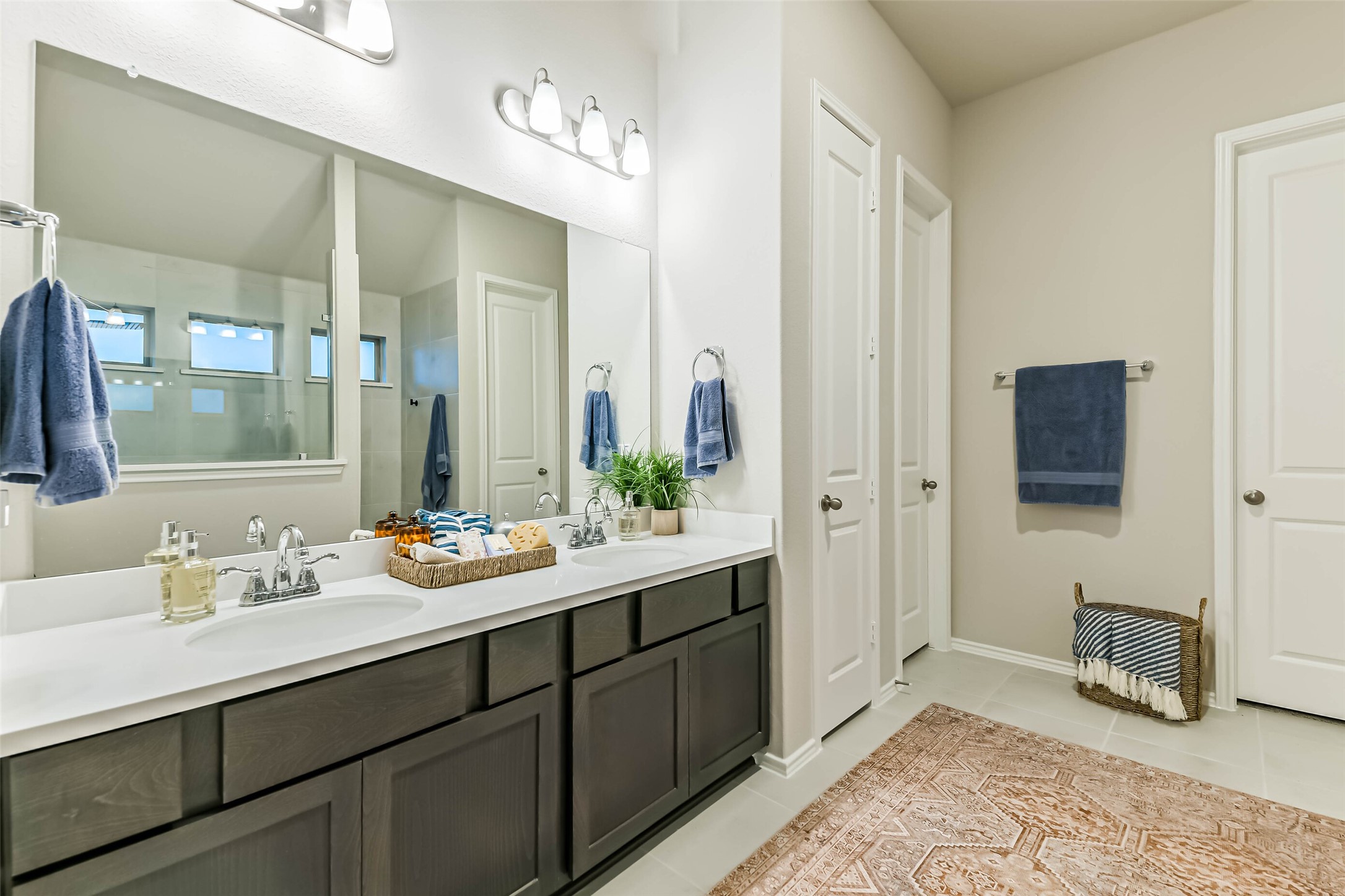 1337 Lakeside Crk Road Magnolia, TX 77354 - Photo 20 of 34 a en suite bathroom with double sink and a mirror