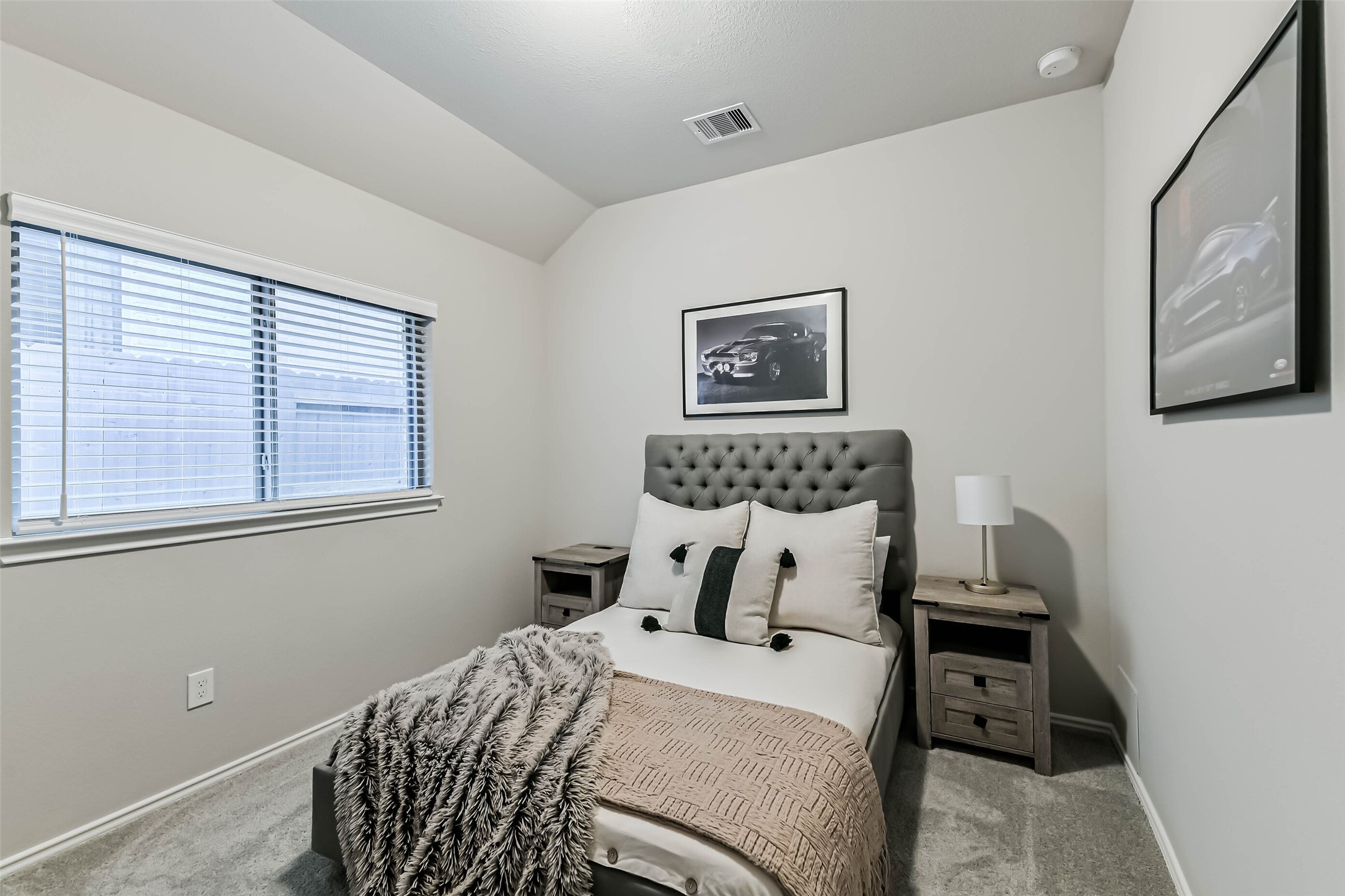 1337 Lakeside Crk Road Magnolia, TX 77354 - Photo 22 of 34 a bedroom with a bed and a painting on the wall