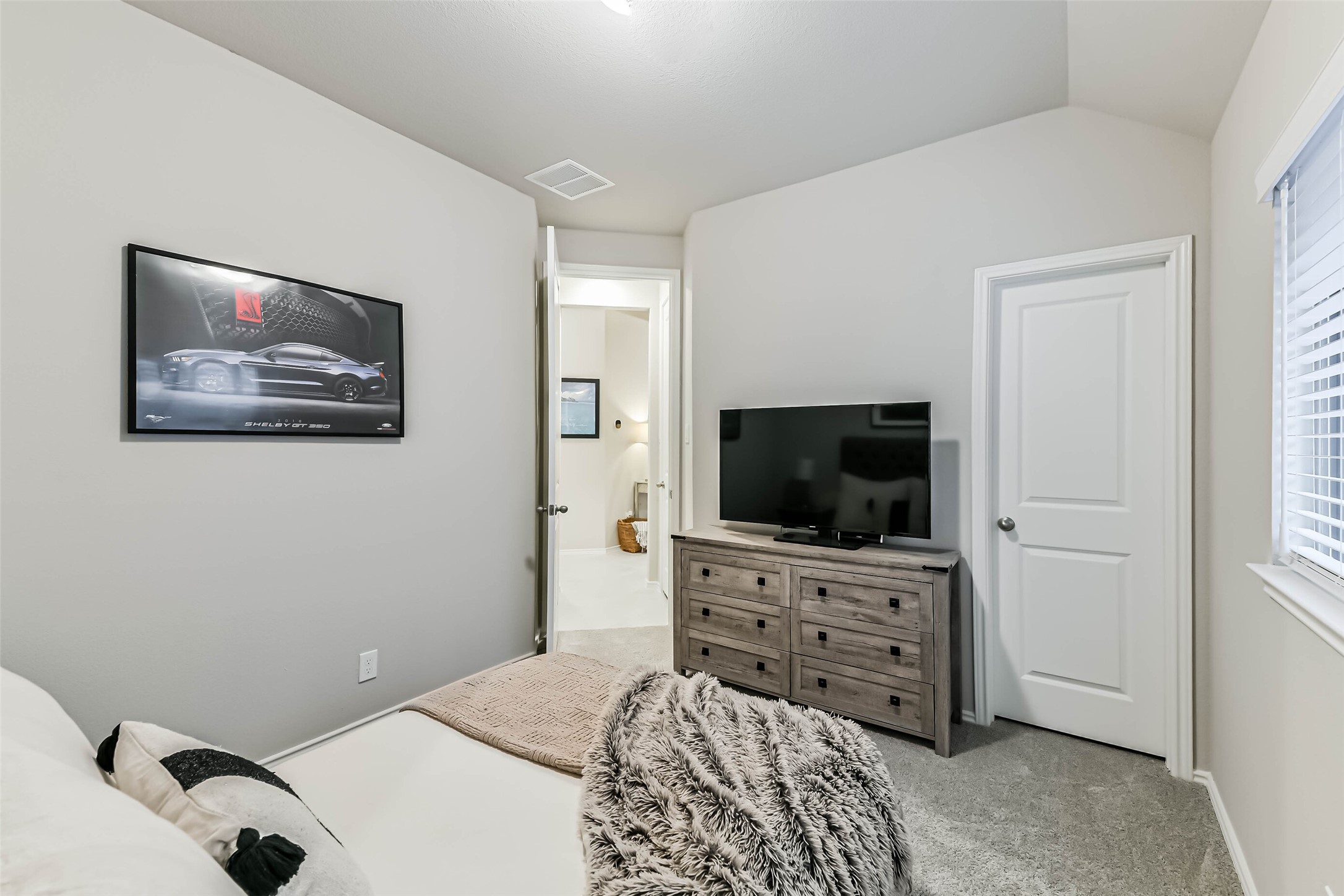 1337 Lakeside Crk Road Magnolia, TX 77354 - Photo 23 of 34 a bedroom with a bed and a flat screen tv