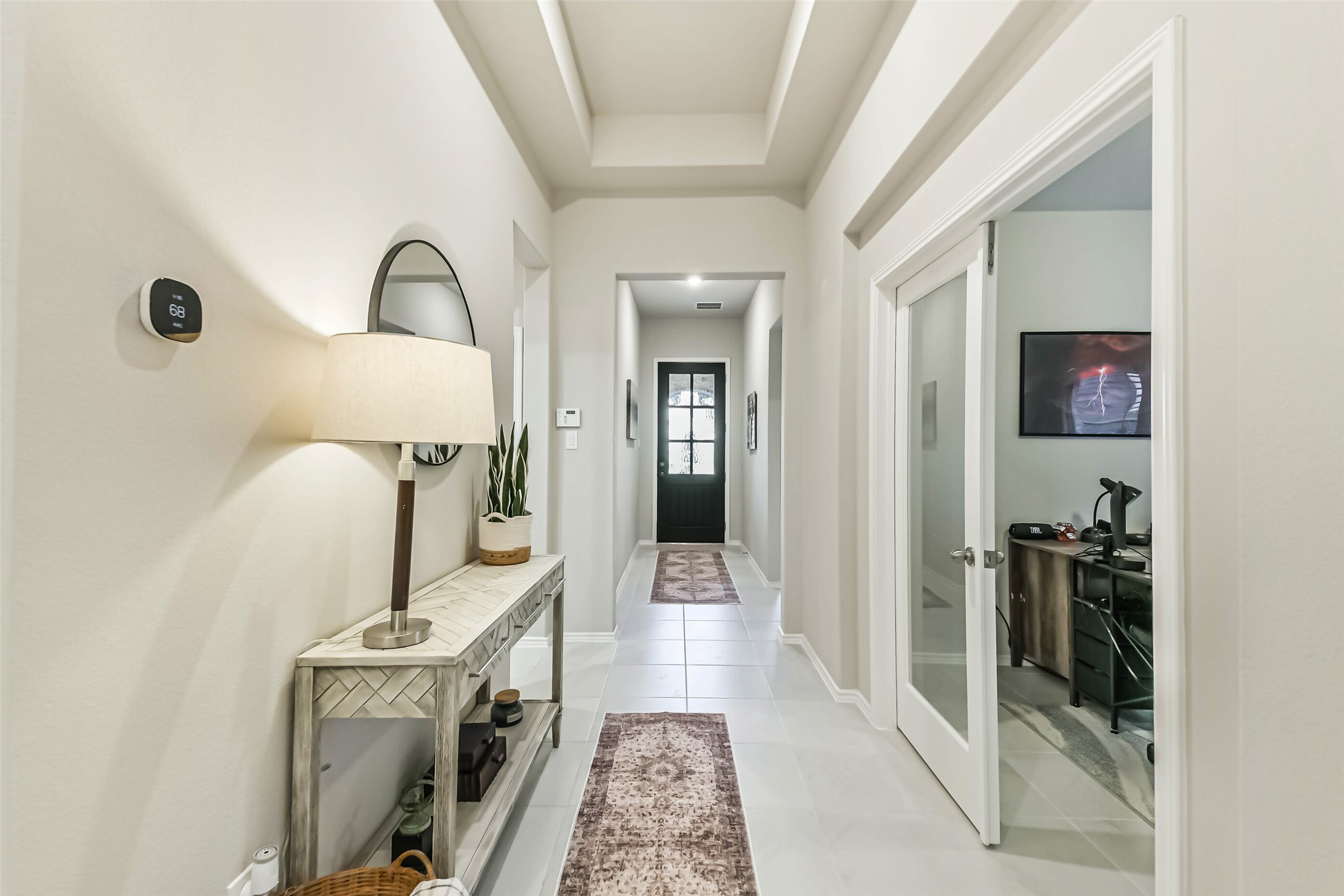 1337 Lakeside Crk Road Magnolia, TX 77354 - Photo 3 of 34 a view of a hallway with a livingroom and furniture